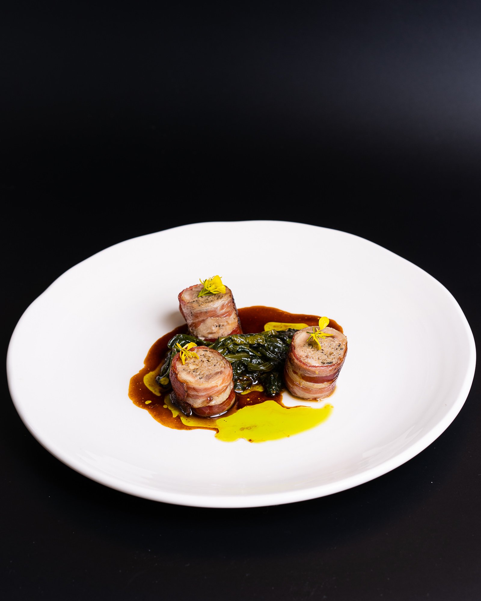 Stuffed quail with braised spinach pine nuts, raisins and jus2.jpg