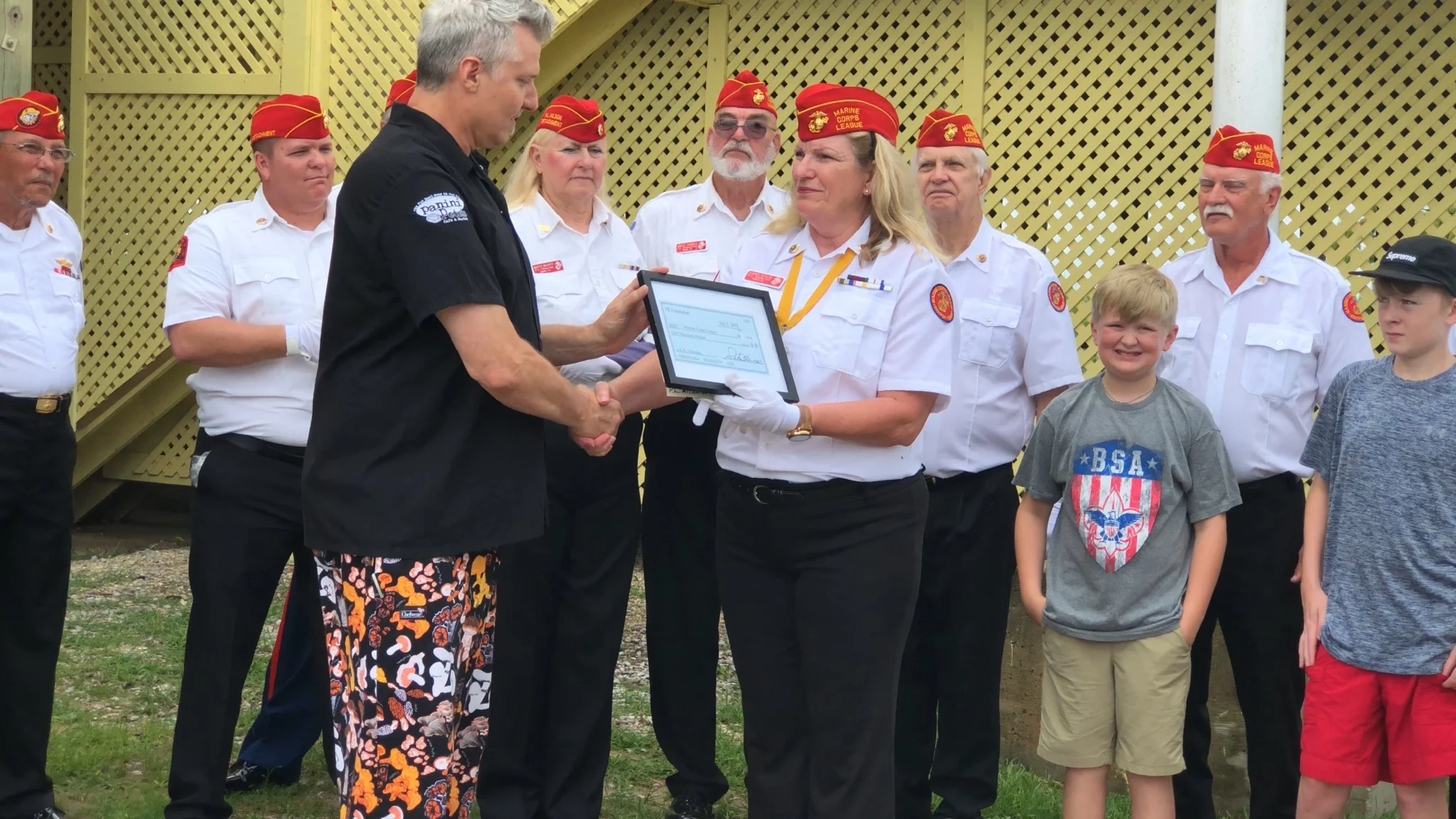 2018 PR Foundation co founder Pete Blohme presenting a check to the to the local Marine Corp league for a electric wheelchair for a war veteran from Alabama.