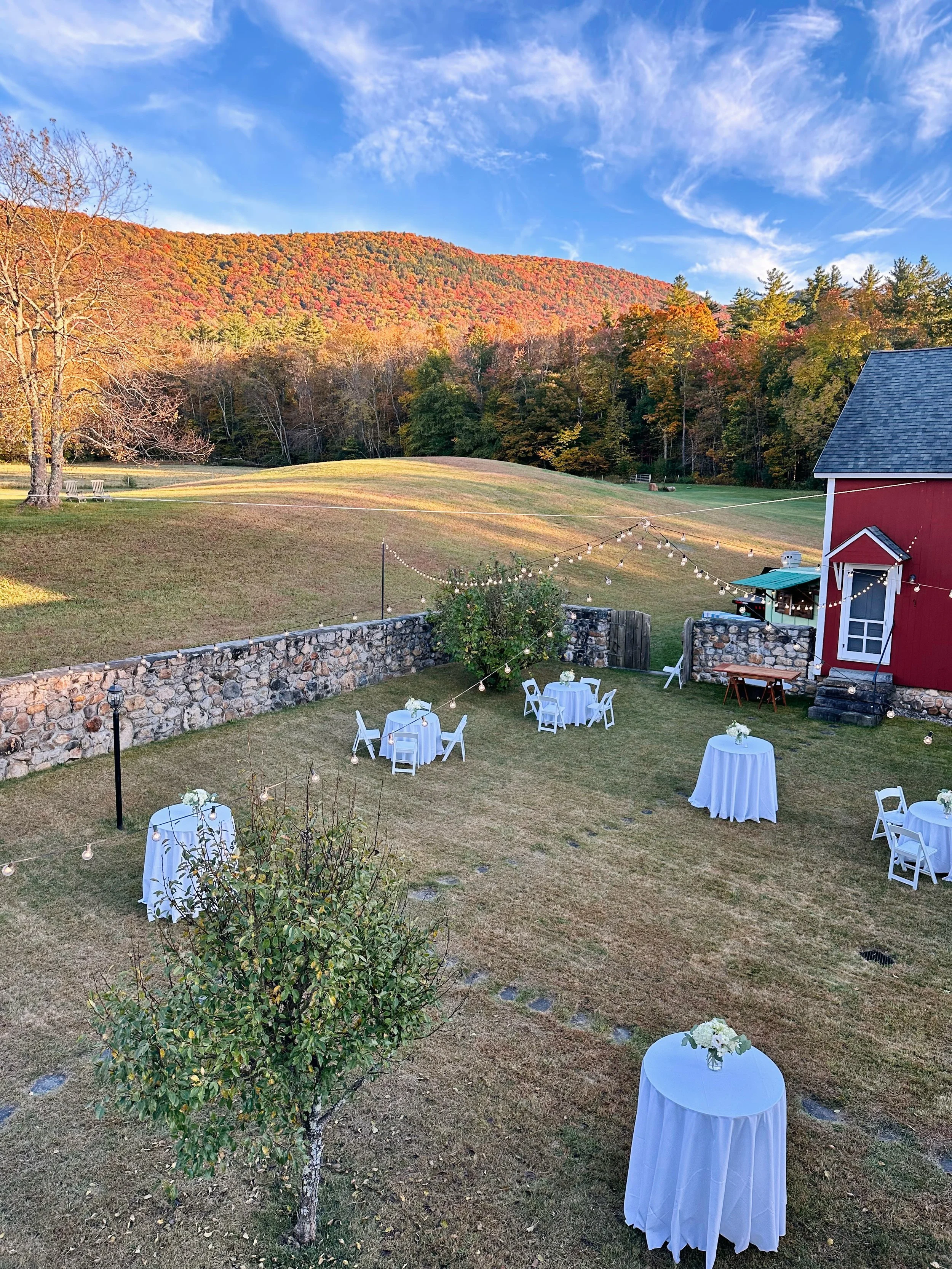 Cocktail hour with a view 🍁 🍹 &bull; 

The French Courtyard dressed in autumn color, with the Green Mountains putting on quite the show in the background. ✨

An outdoor fall rehearsal dinner is always a good idea when in Vermont! 🍂 

#boornbrookfa