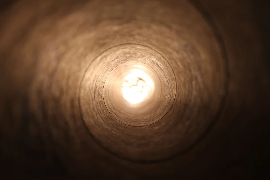 looking up at light shining in the hole that swallowed you