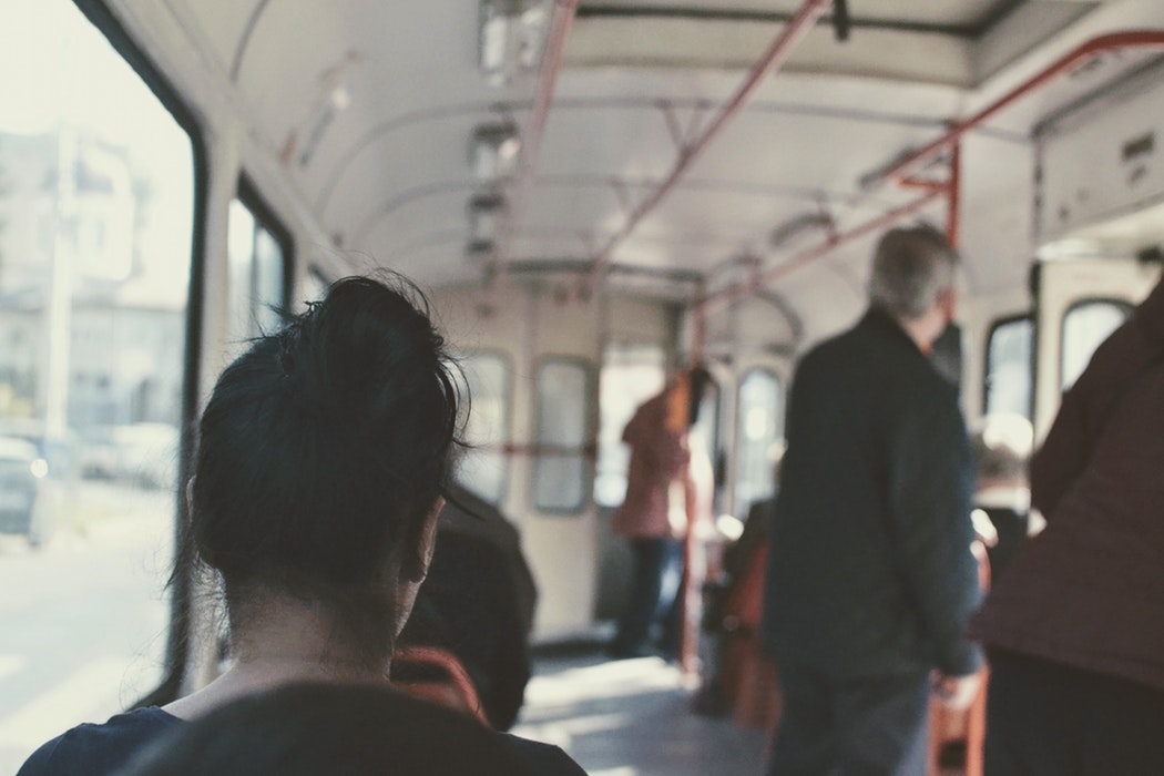 woman with anxiety sitting on train