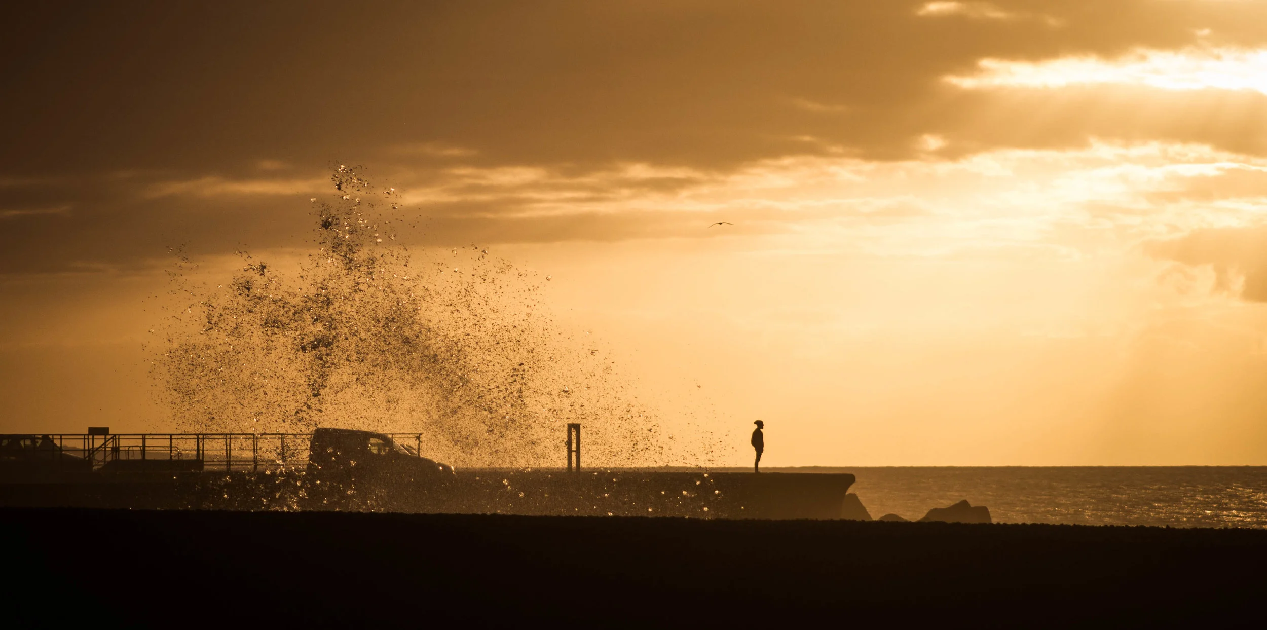 woman standing on pier with waves of depression behind her
