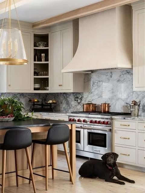 Designed with intention, this Morningside kitchen brings together custom cabinetry, sculptural form, and enduring materials. From the tailored hood to warm wood accents, every element is considered. 

Photography: @laurenchambers_interiorsphoto
Inter