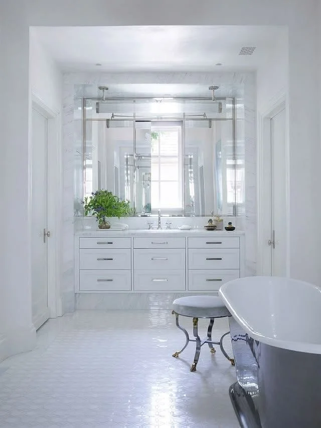 Storage that stuns! You wouldn't know it, but a medicine cabinet is concealed in the wall of this vanity area, where marble and nickel create a showstopping moment. 

Interior design: @barbarawestbrookinteriors
Architect: @summerour_architects 
Photo