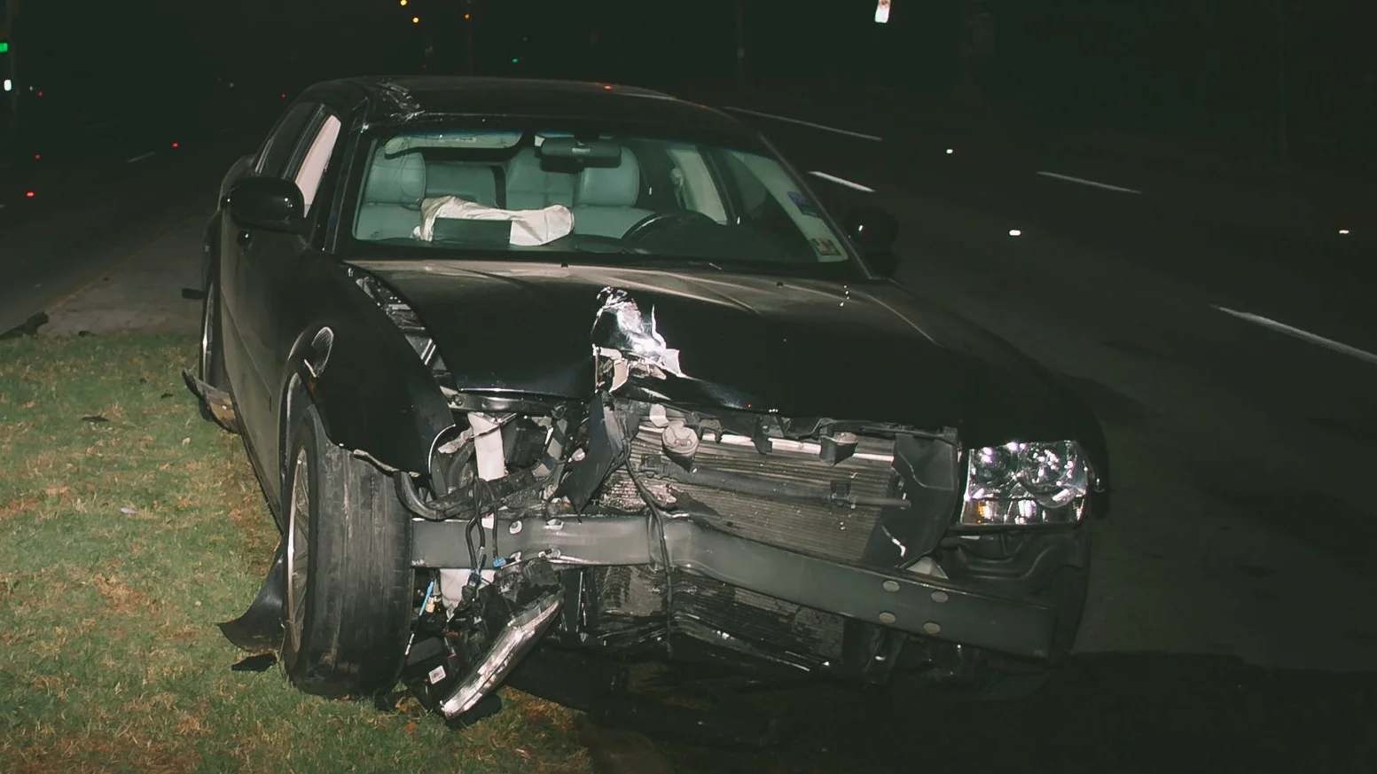 Car with significant front-end damage.