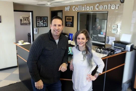 John D'Aniello, co-owner, and Katrina Joyce, manager, stand in the waiting area of M3 Collision Center in Neptune, NJ Tuesday, February 19, 2019. (Photo11: Tanya Breen, APP.com)