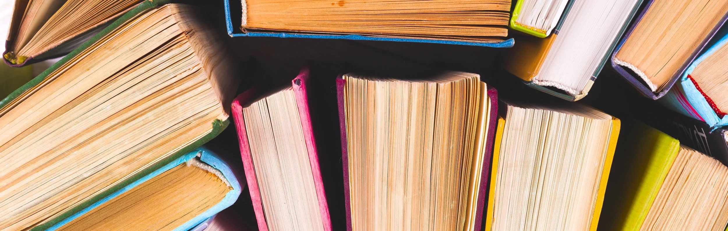 bigstock-Open-Book-Hardback-Books-On-B-228239119-1.jpg