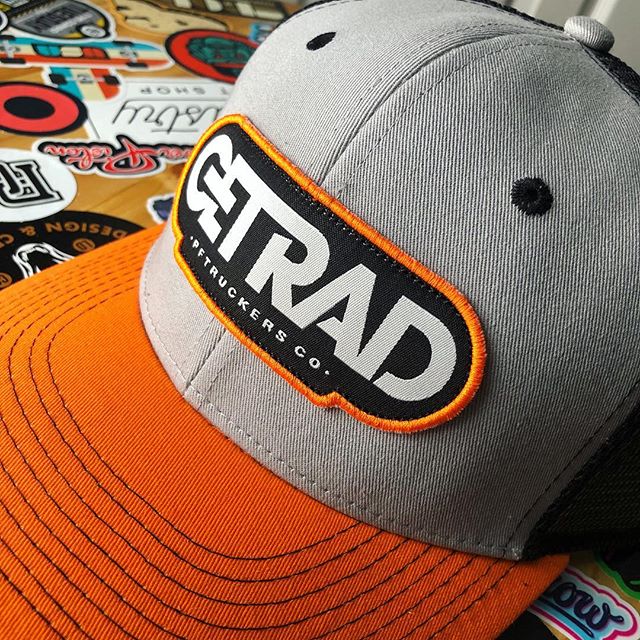 It&rsquo;s Friday and that can only mean one thing... it&rsquo;s time to #getrad. Pictured here is our official get rad mesh trucker. Fiery Sun Orange bill, Seattle Gray face and Black Flag black mesh. Grab one at the link in our bio!