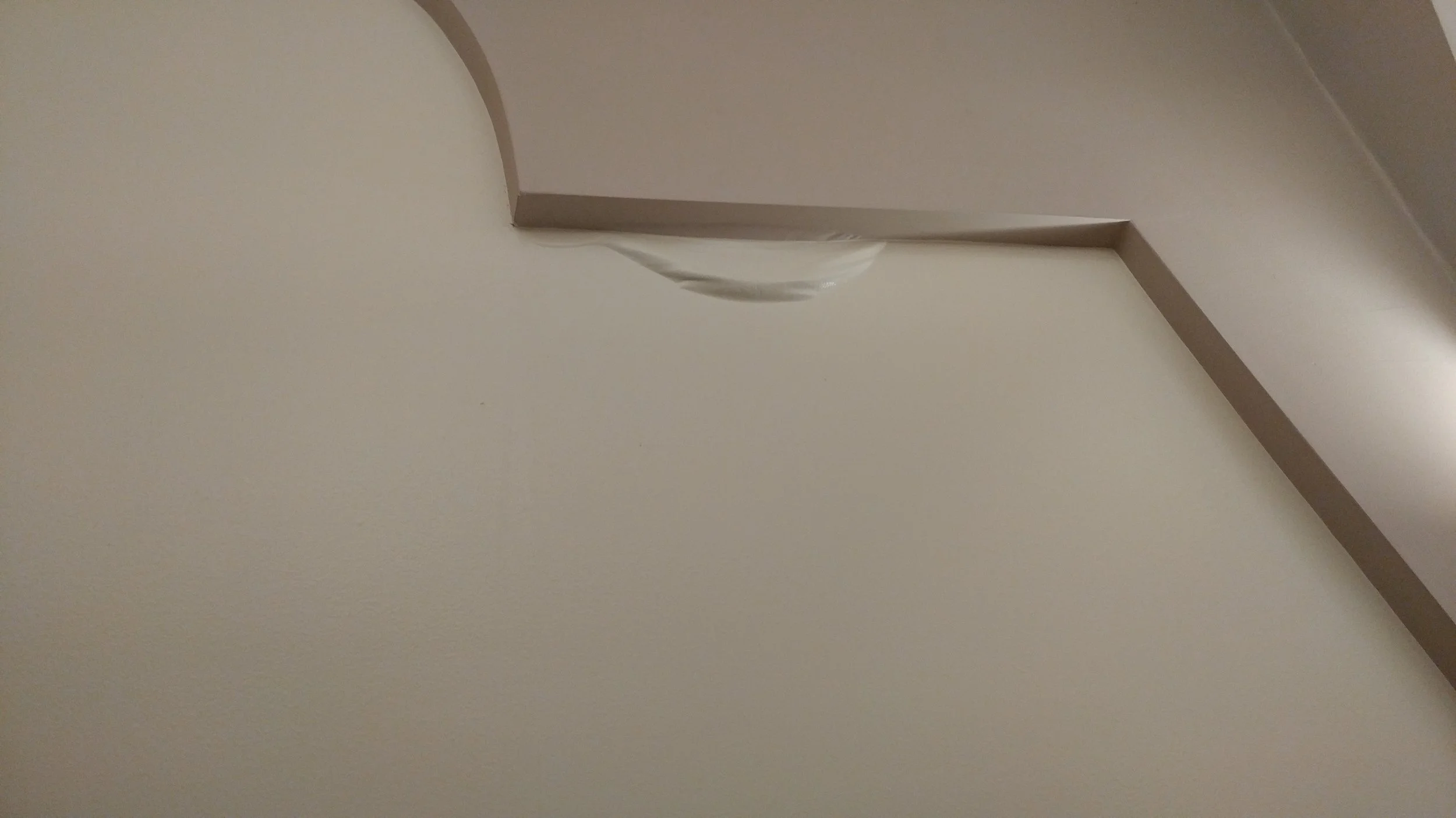 Interior wall water damage in the Worship Space.