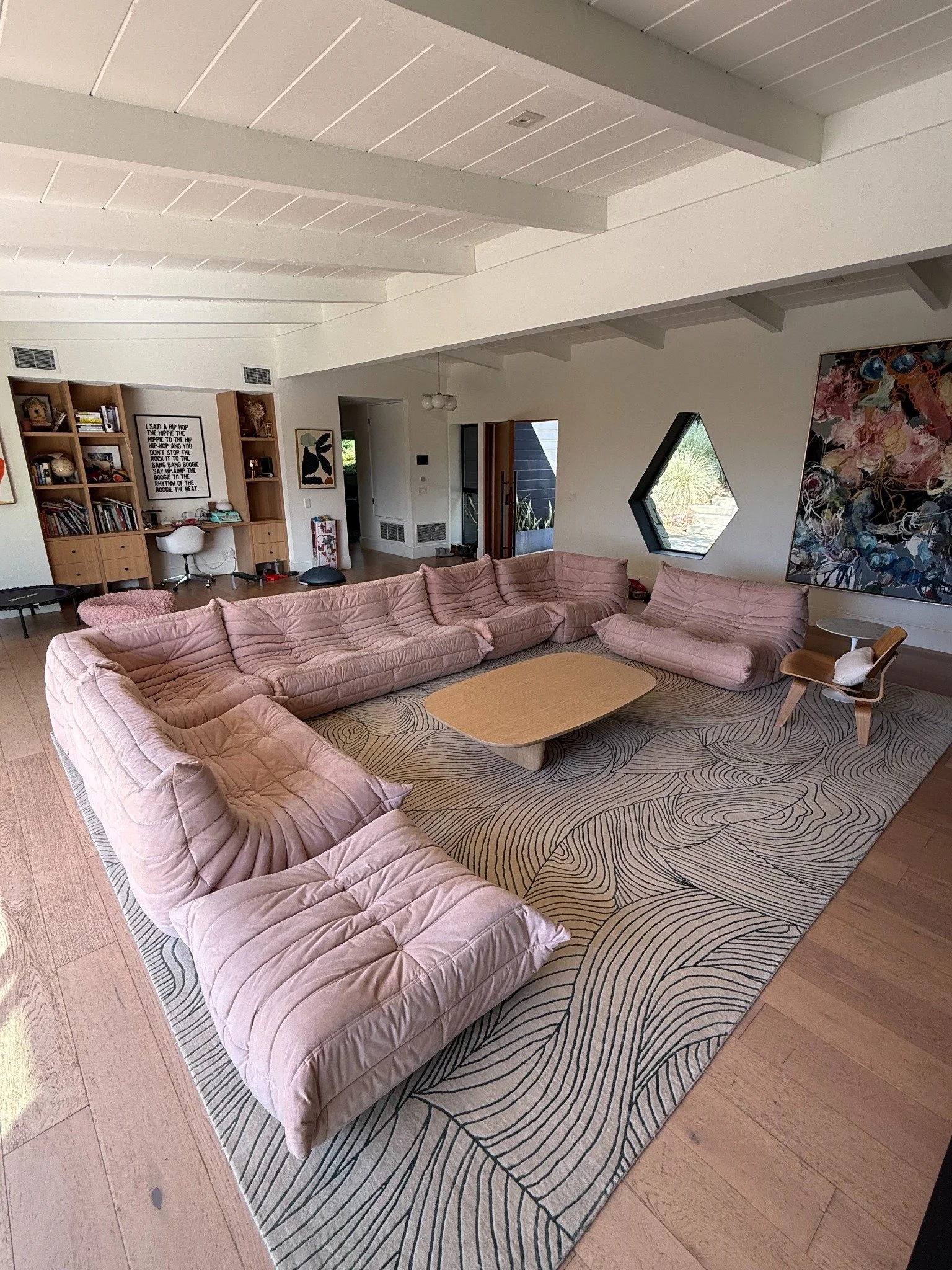 Restored pink leather sectional in a living room
