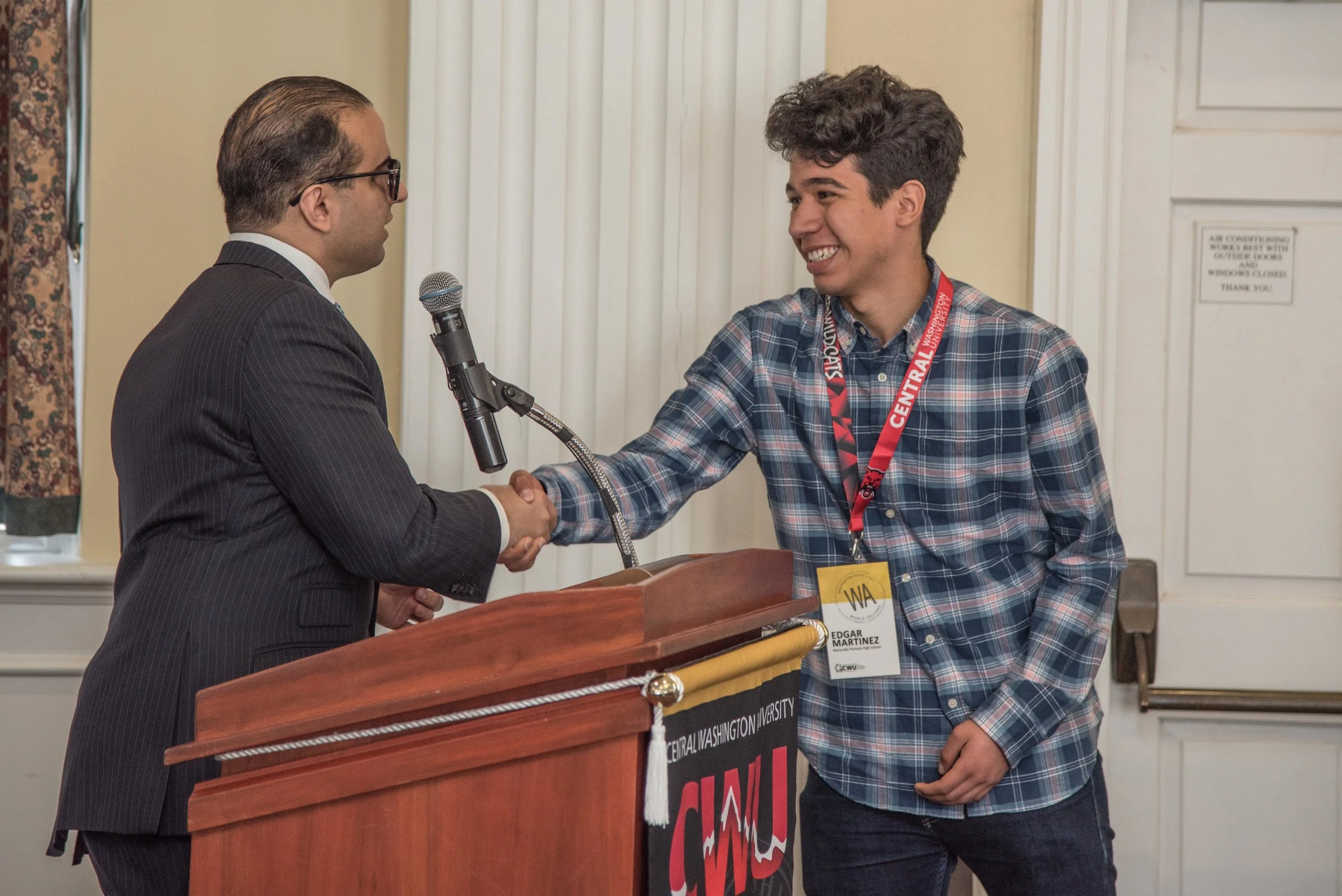 Lt. Governor shakes hands with newly-selected Fellow, Edgar Martinez