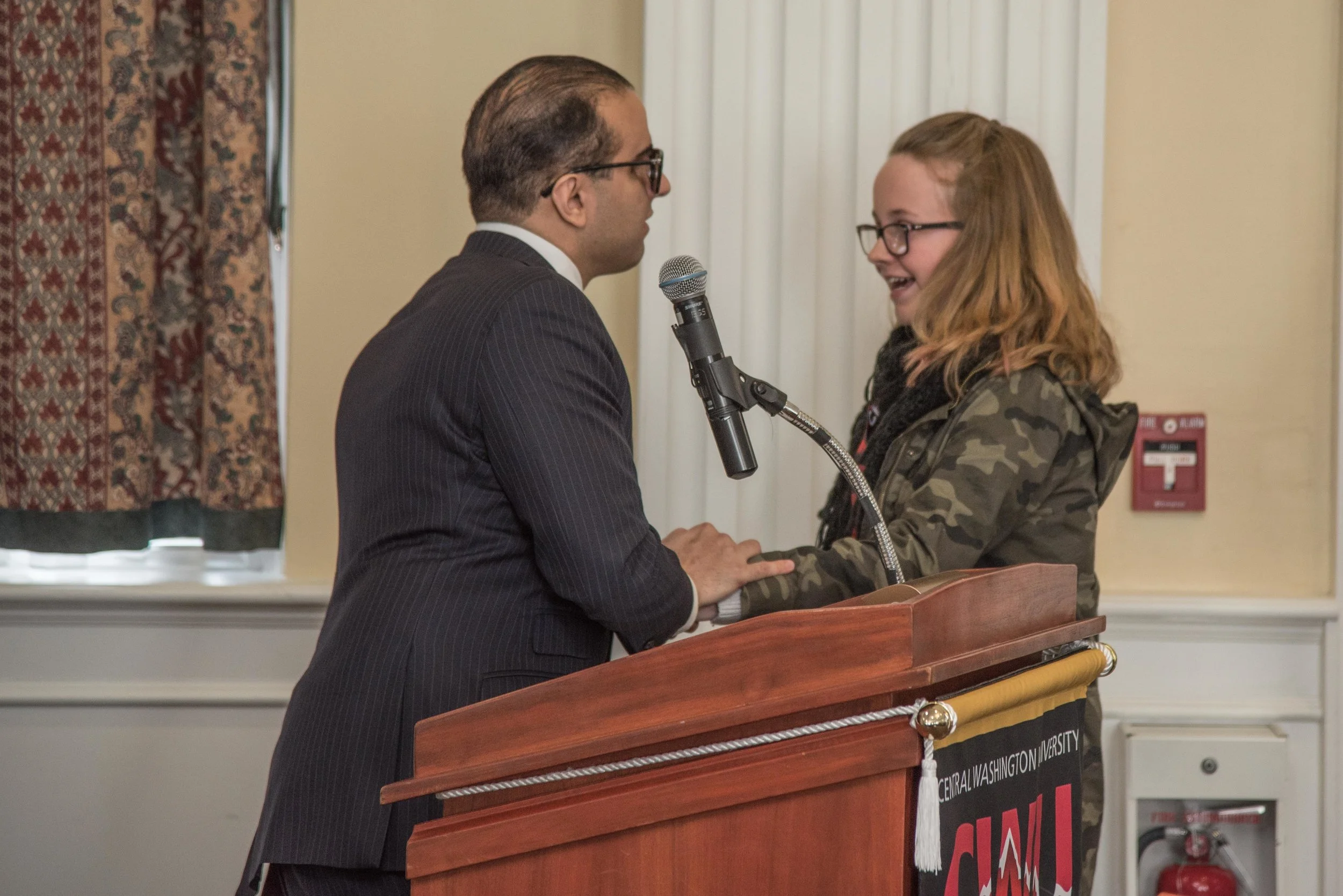 Lt. Governor shakes hands with newly-selected Fellow, Emersen Slanga.