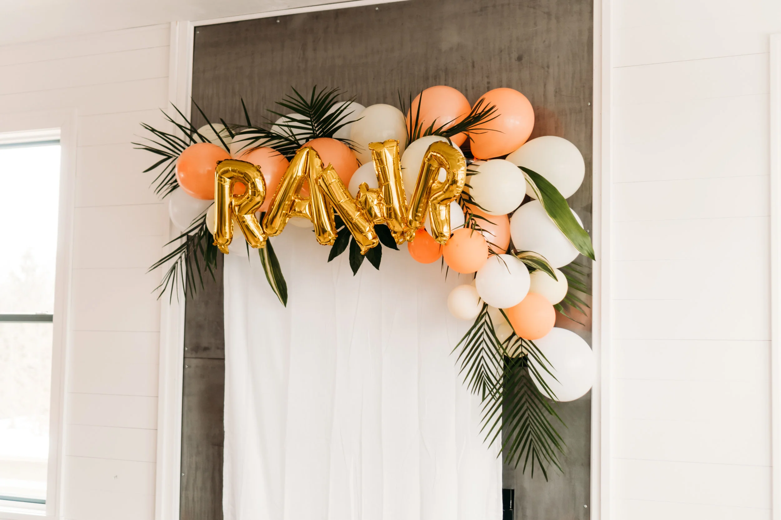 This was our first attempt ever at making a balloon arch and darn these are way harder than they look. Luckily it held up well throughout the party and the weight of the fresh tropical leaves didn’t rip it off the wall. I would probably redo this with a specific stand. SEMI-PRO TIP: When hosting a 2 year old party, don’t make a balloon arch that touches the ground. Children would destroy it quickly. Keep it out of reach!