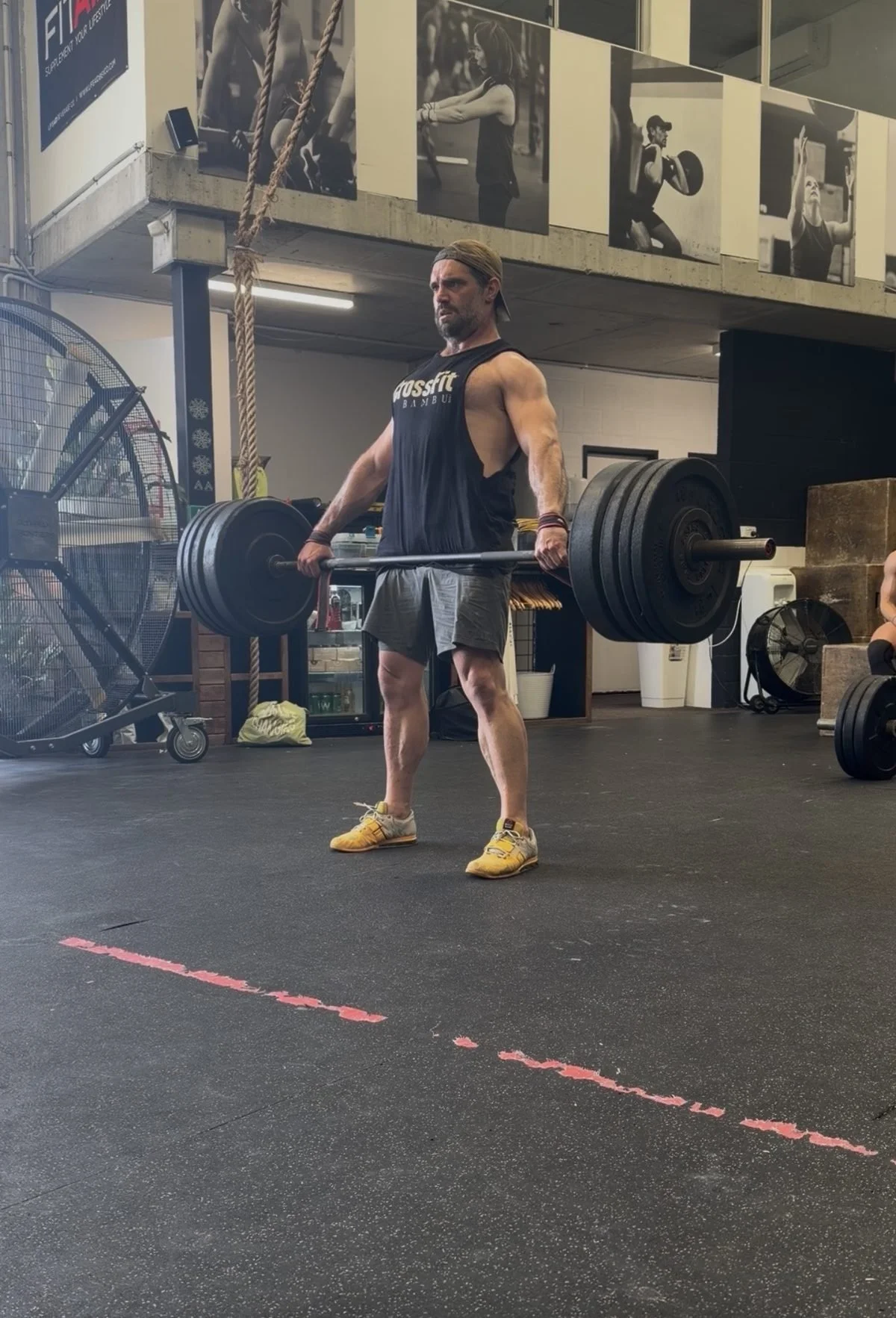Member locking out a heavy deadlift at Accelerate Strength gym in Rozelle