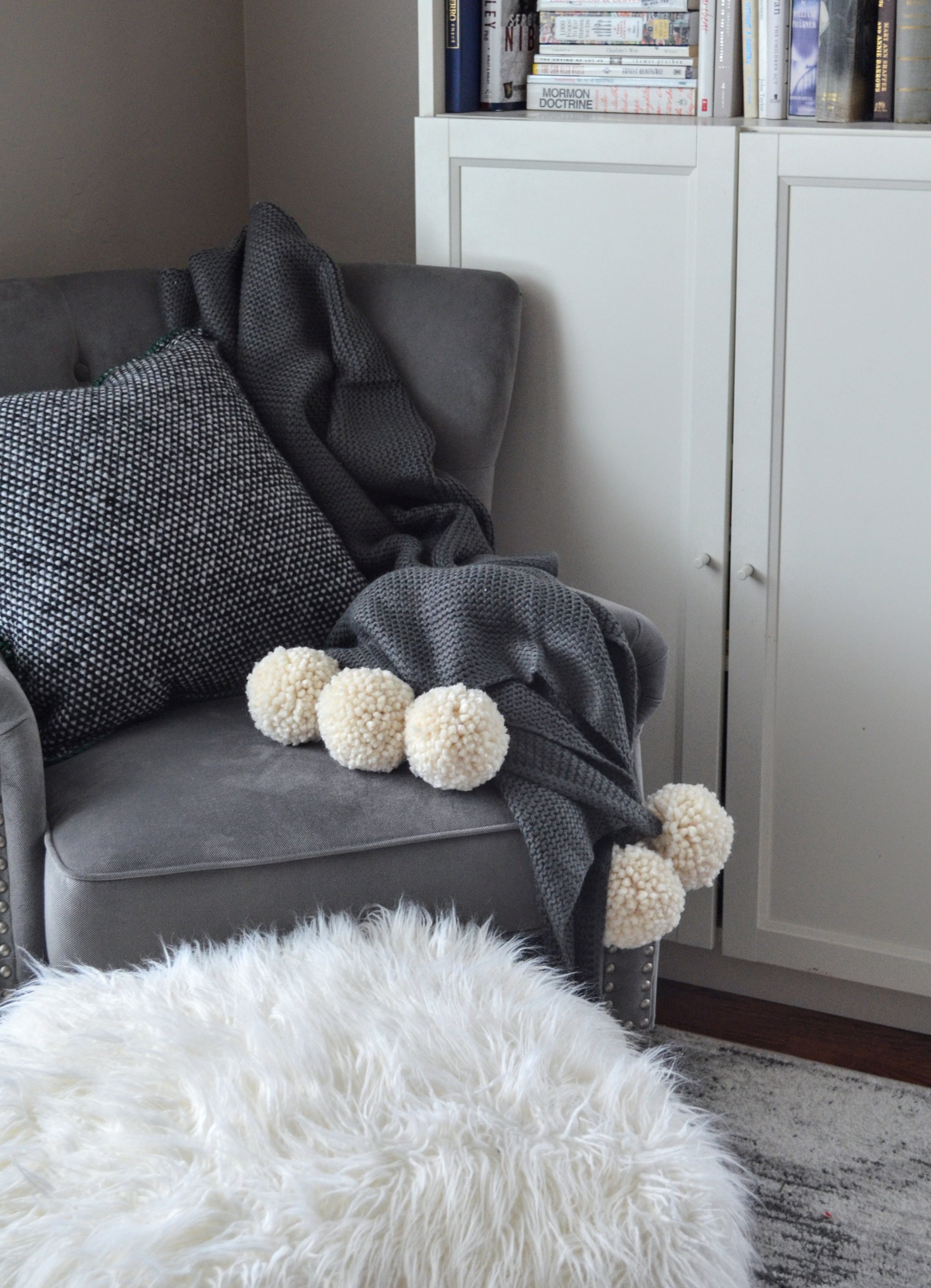 Cozy Up Your Home Adding Pom Poms and Tassels to Blankets and