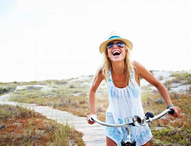 woman_cycling_laughing