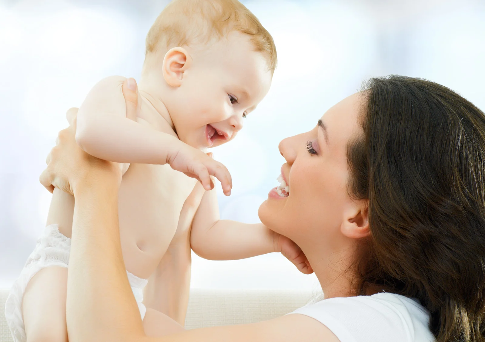 Happy-mother-with-the-child-on-the-hands.jpg