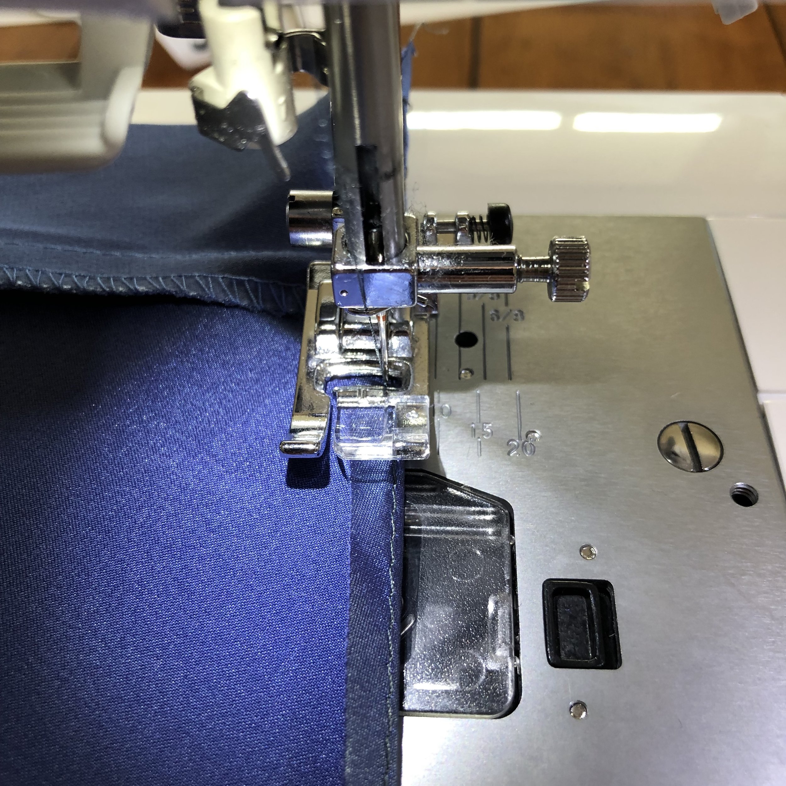  Fold it toward the wrong side and sew it down, following the original stitch line 