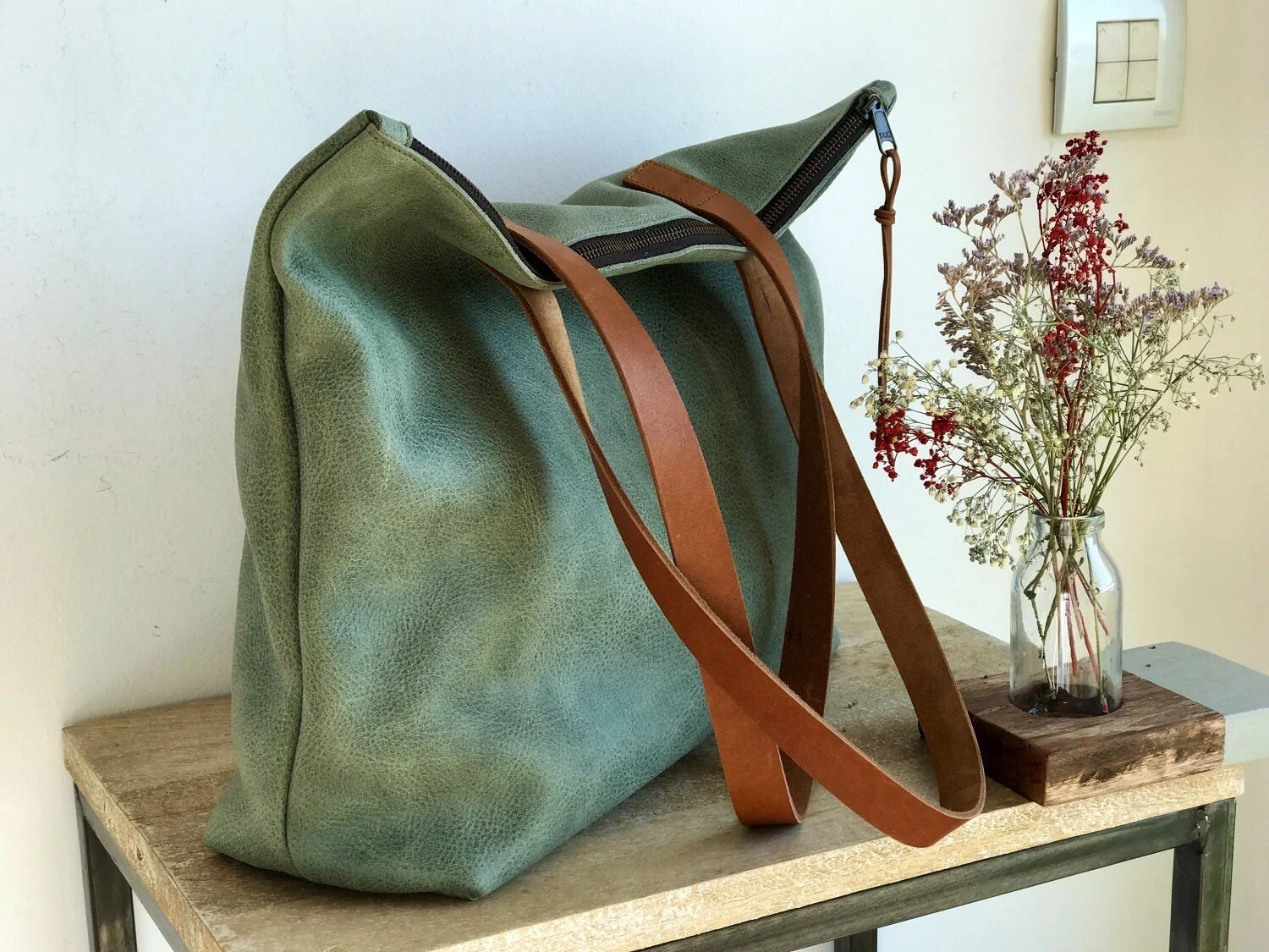 green leather pouch