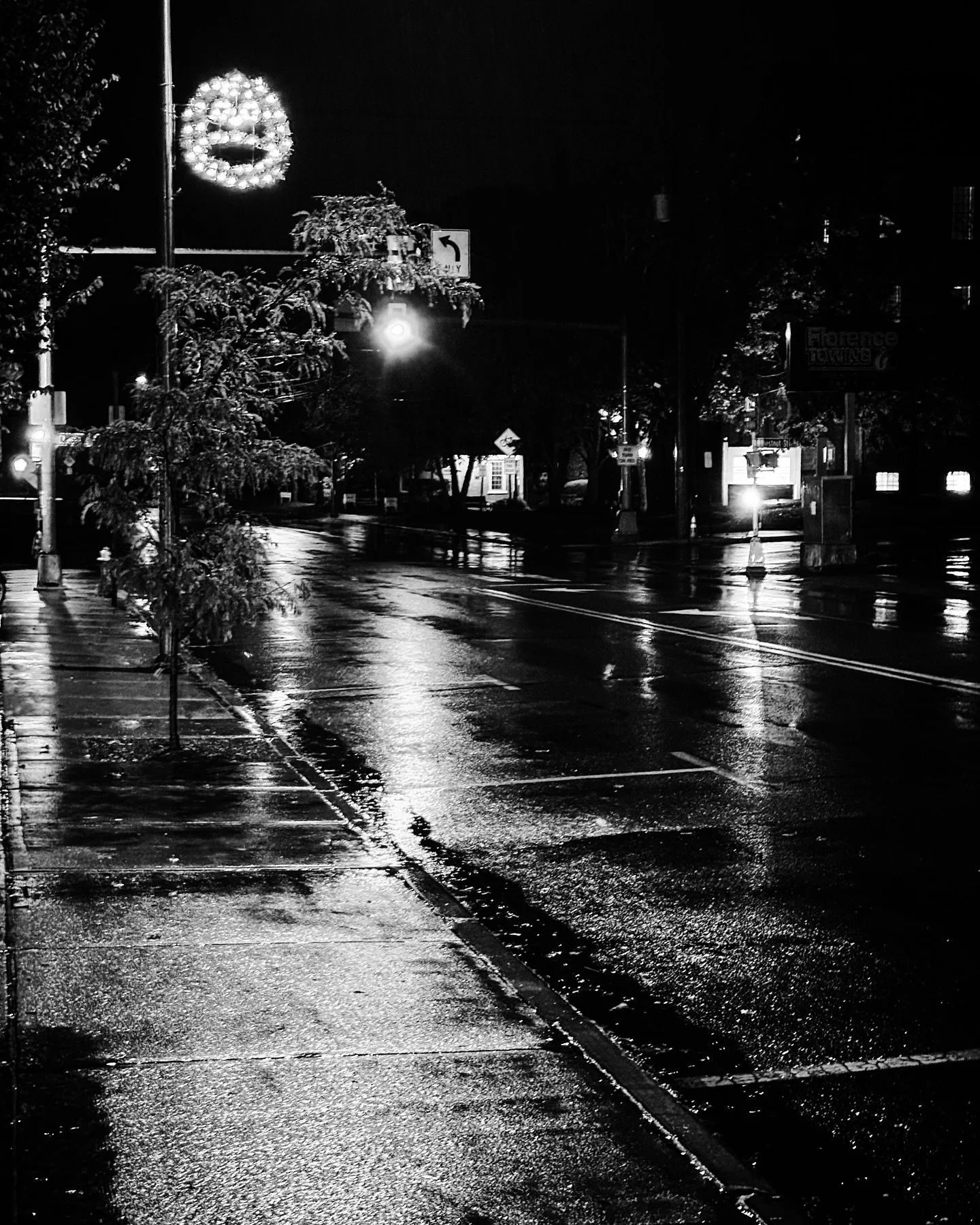 Rainy night street view #rainy #nightphotography #streetphotography #blackandwhitephotography #spookyseason #blackandwhite