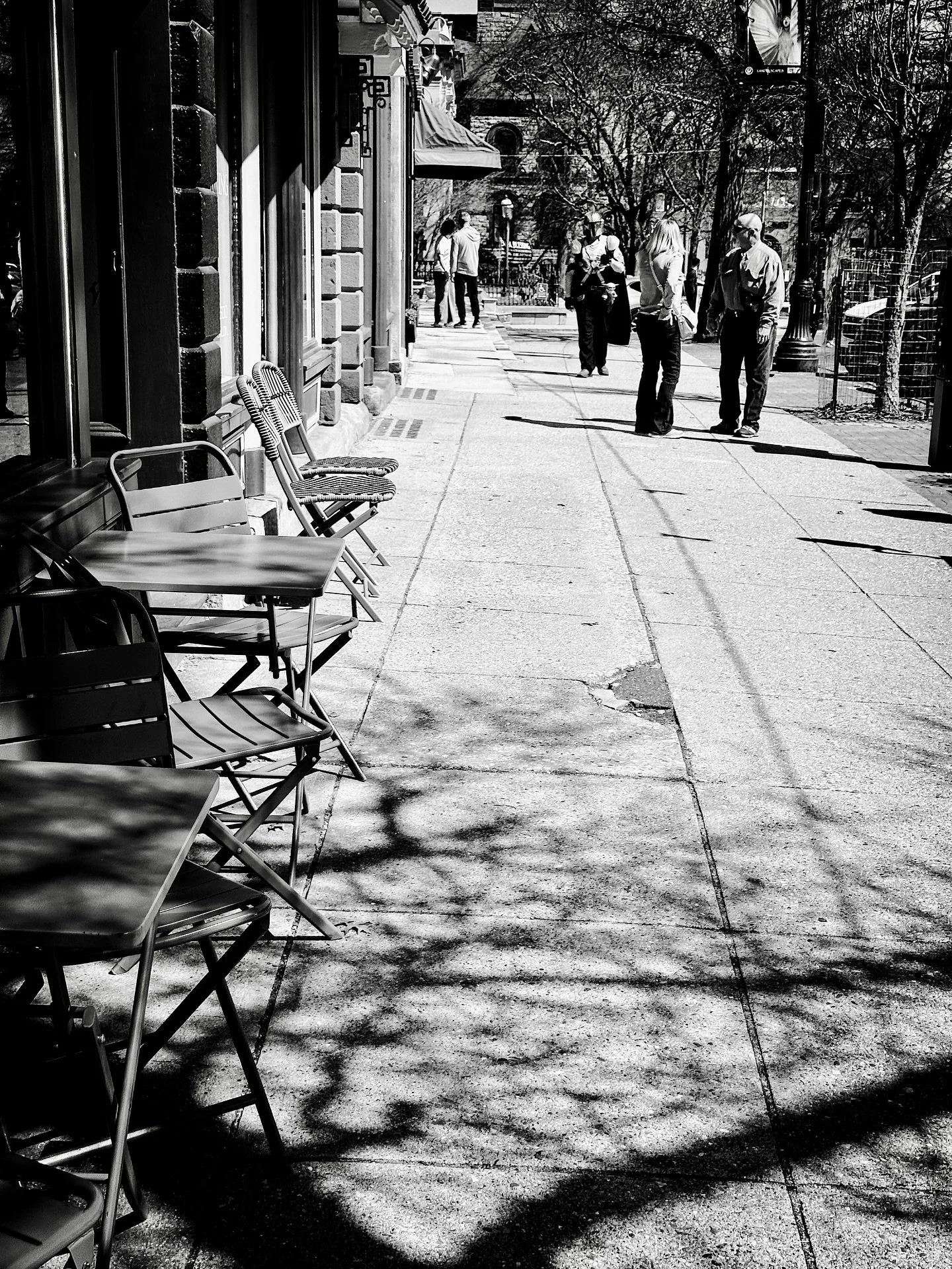 Street scene with Mandalorian #streetphotography #streetphotos #blackandwhitephotography #blackandwhite #spring #trees #shadows