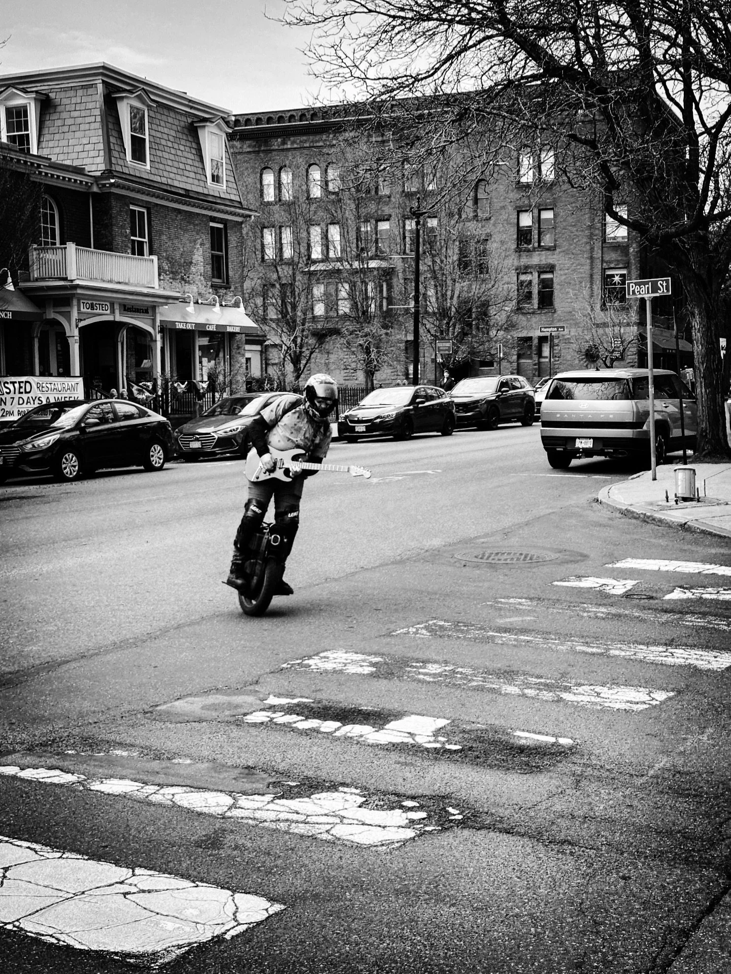 Unicycle guitar guy #streetphotos #streetphotography #blackandwhite #blackandwhitephotography #streetstyle #architecture