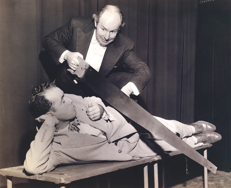 1950 - as a young San Diego newspaperman, he was sawed in half by the Great Virgil.