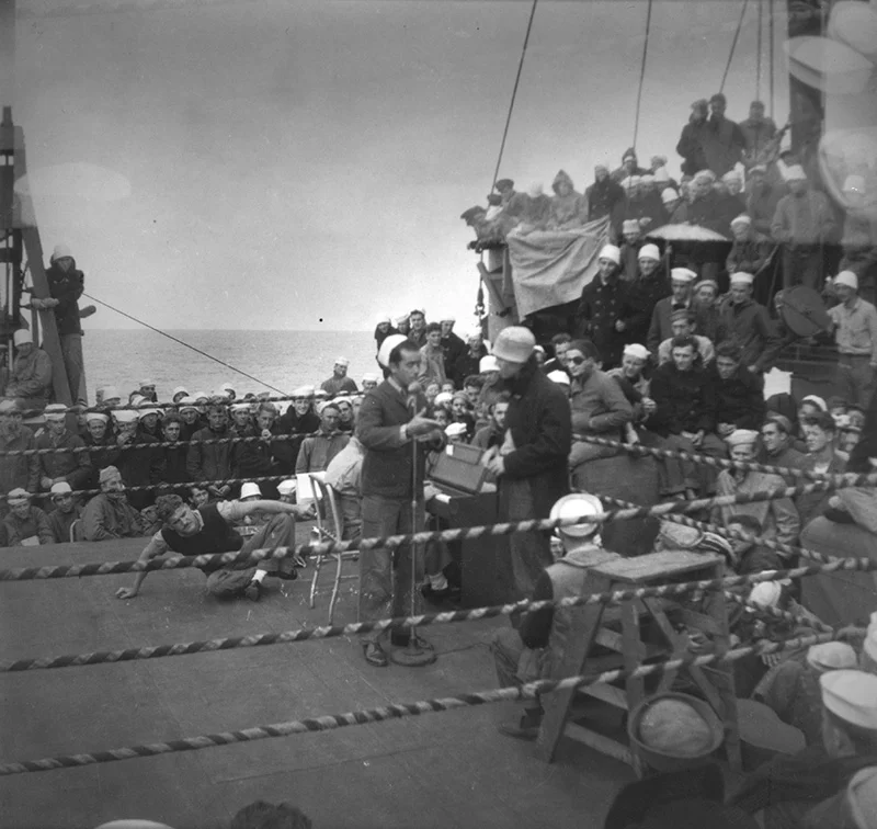 Sid entertaining his Navy shipmates with a magic trick.