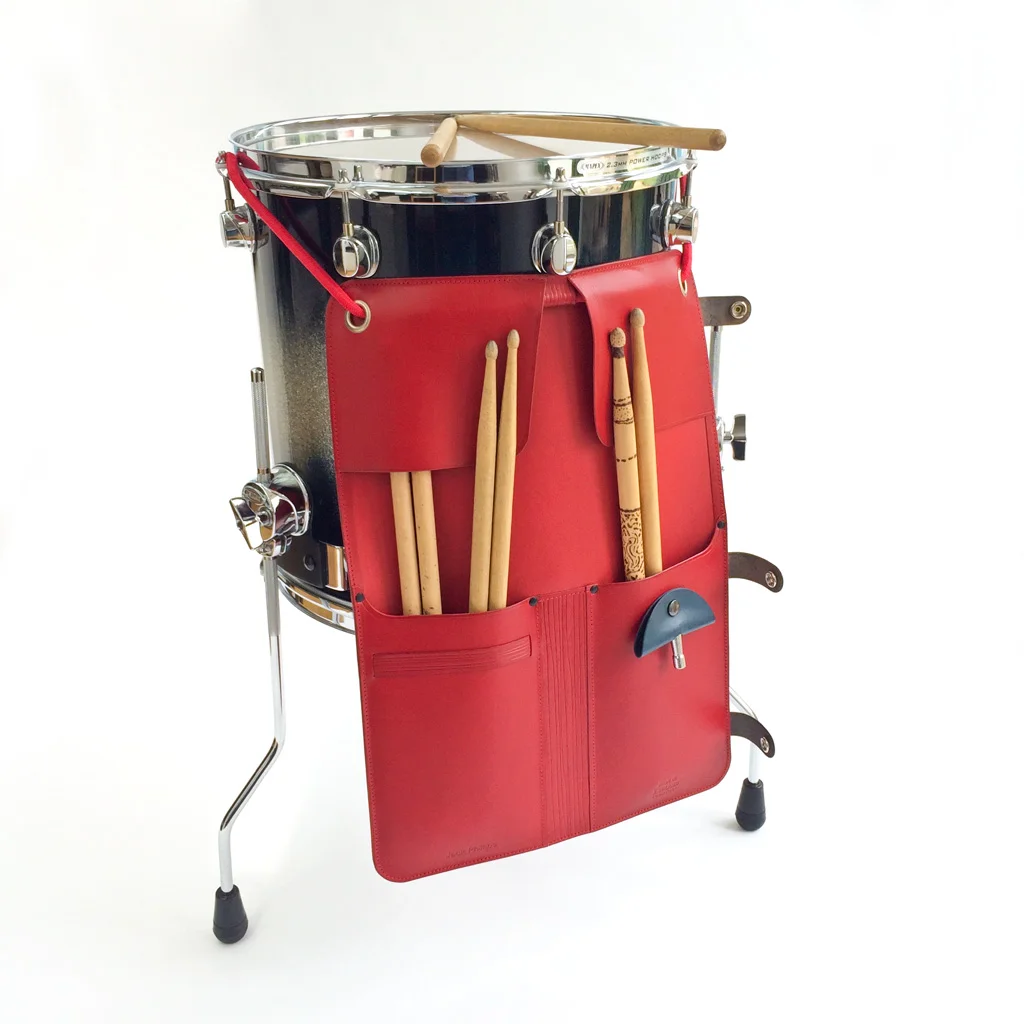 Johny Todd red leather drumstick case attached to a floor tom drum