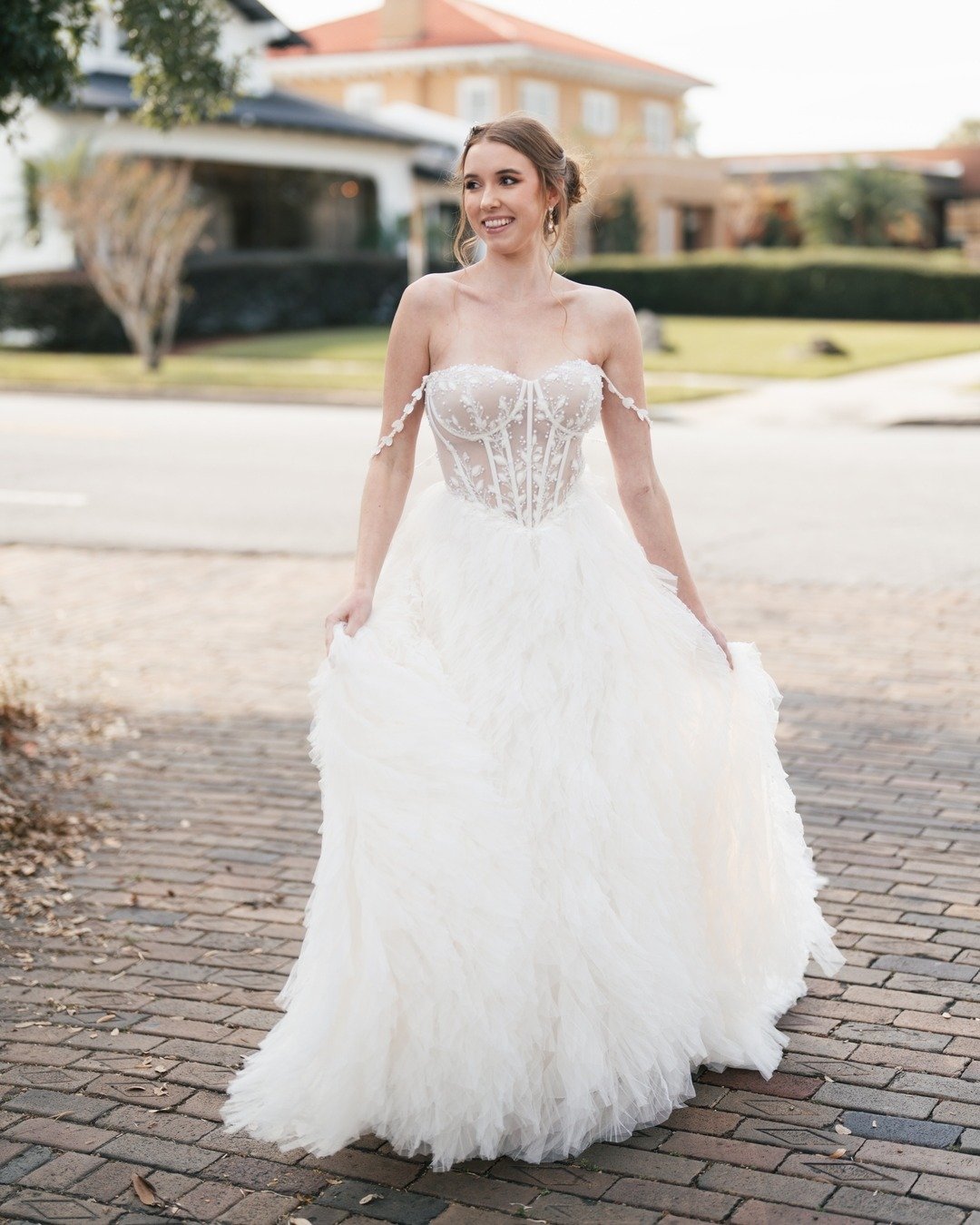 She&rsquo;s a fan favorite for a reason ✨ From the romantic off-shoulder straps to the dreamy feathered skirt, this gown turns every moment into magic. Would you say &ldquo;yes&rdquo; to this dress? 

#justmarried #bridetobe #weddingdress #weddingdre