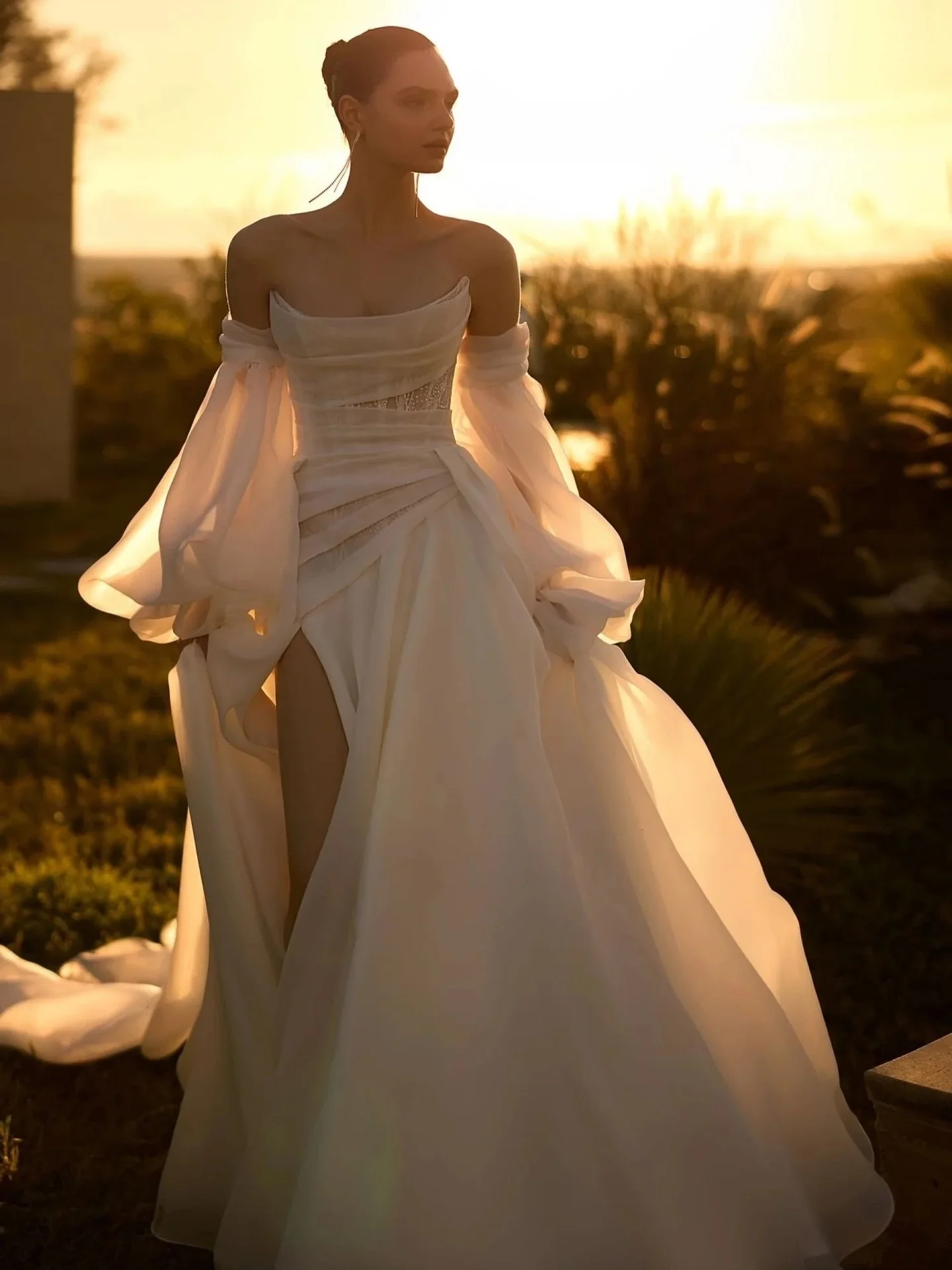 Luxurious minimalism meets modern romance 🤍
An ivory A-line gown crafted in textured glitter organza. 
Complete with a draped corset, airy train, and detachable sleeves for the perfect touch of drama.

#bridal #bridalinspo #wedding #weddingdresses #
