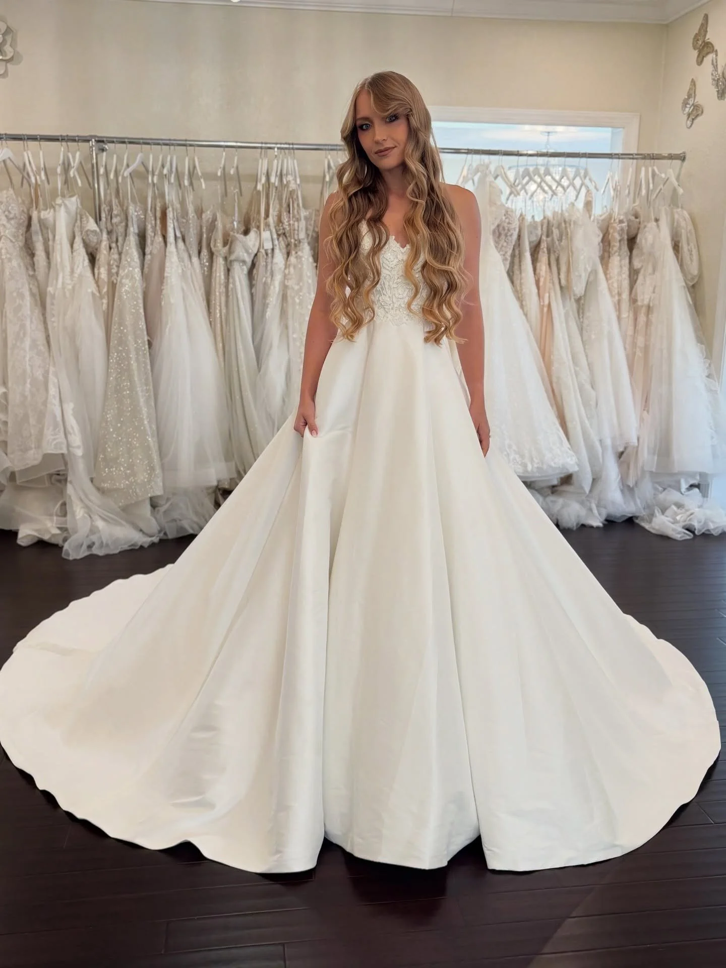 Minimalist design, maximum impact. This Mikado A-line gown pairs clean lines with a touch of shimmer in the bodice.