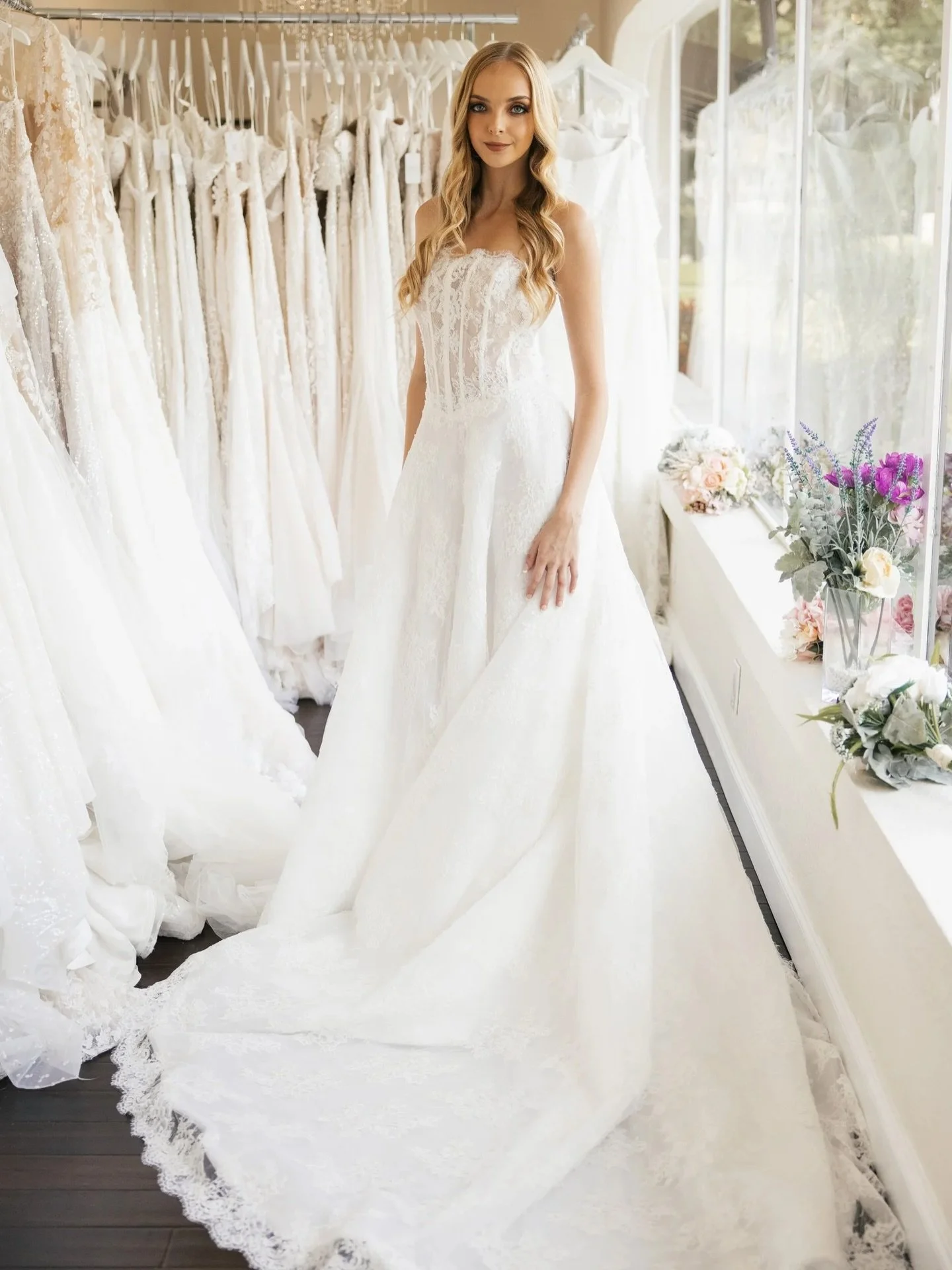 Soft lace, sheer corsetry, and a train made for the aisle. HA3147 is vintage femininity with a modern, romantic finish.