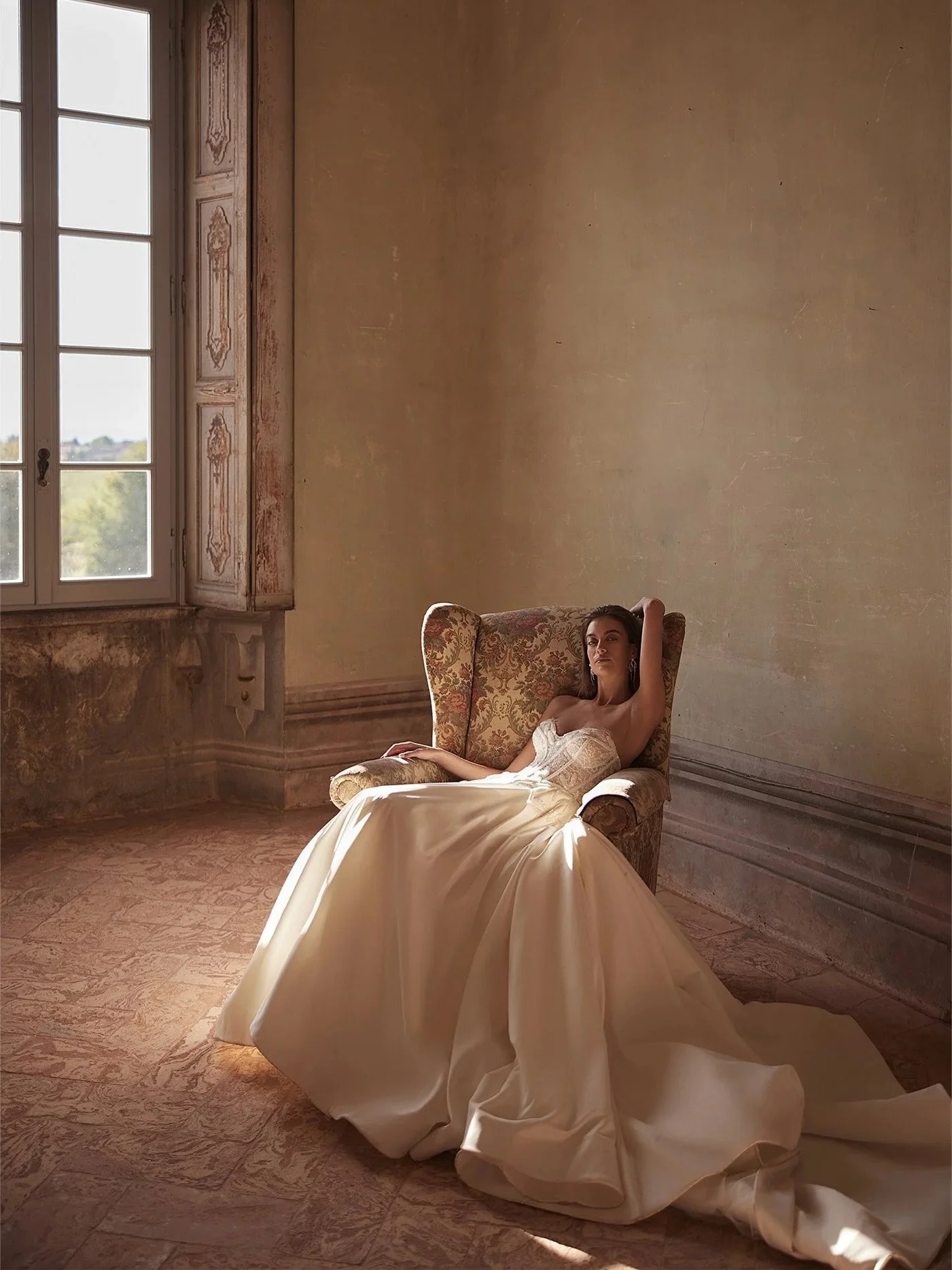 This gown is all about balance.  Staring with a structured corset bodice with delicate lace and beaded details, flowing into an airy skirt that moves beautifully with every step. Timeless, feminine, and made for a truly unforgettable walk down the ai