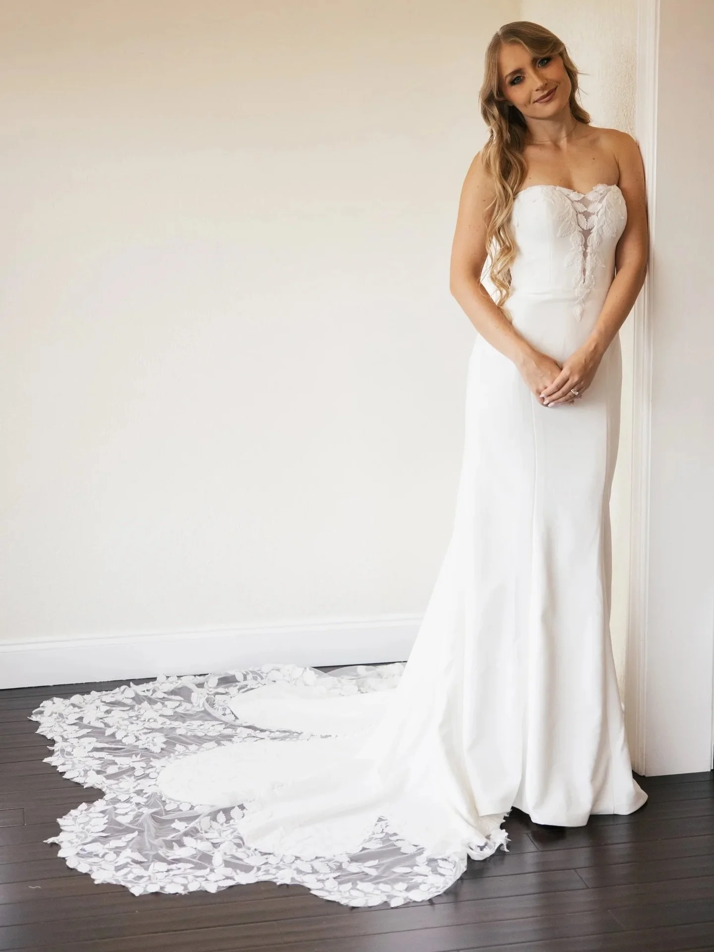 Introducing HA3063, a custom design by Sonthai, tailored for our stunning brides 🤍. This strapless, fitted silhouette features intricate leaf appliqu&eacute; and a romantic lace train. 

strapless wedding dress, fitted bridal gown, lace appliqu&eacu