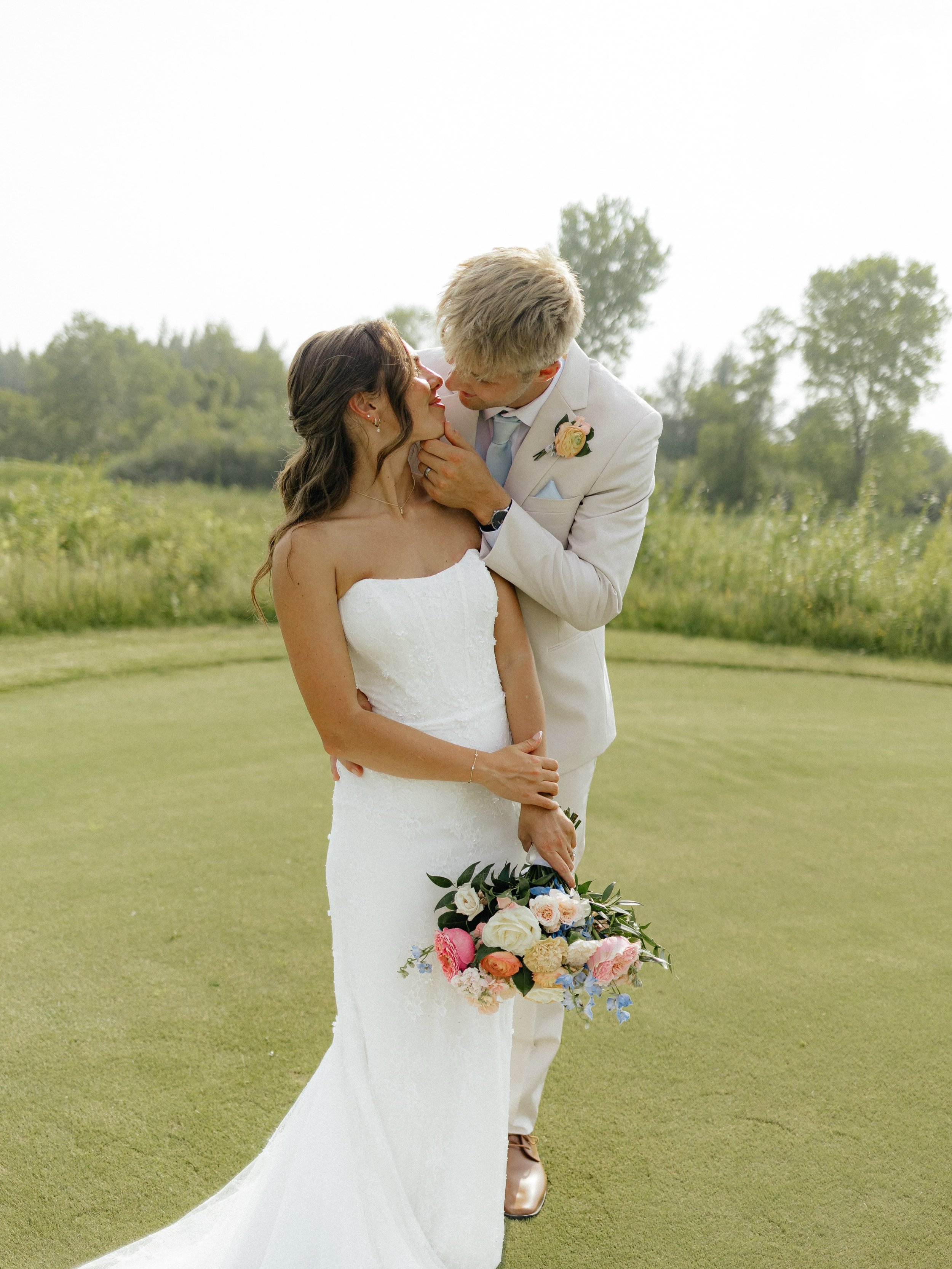 Congratulations to our beautiful bride @peyton.alsum who chose a timeless strapless gown, featuring delicate lace, a softly sculpted neckline, and a sleek fitted silhouette. 

📸: @nataliechristine_photography 

#bgsbride #realweddings
