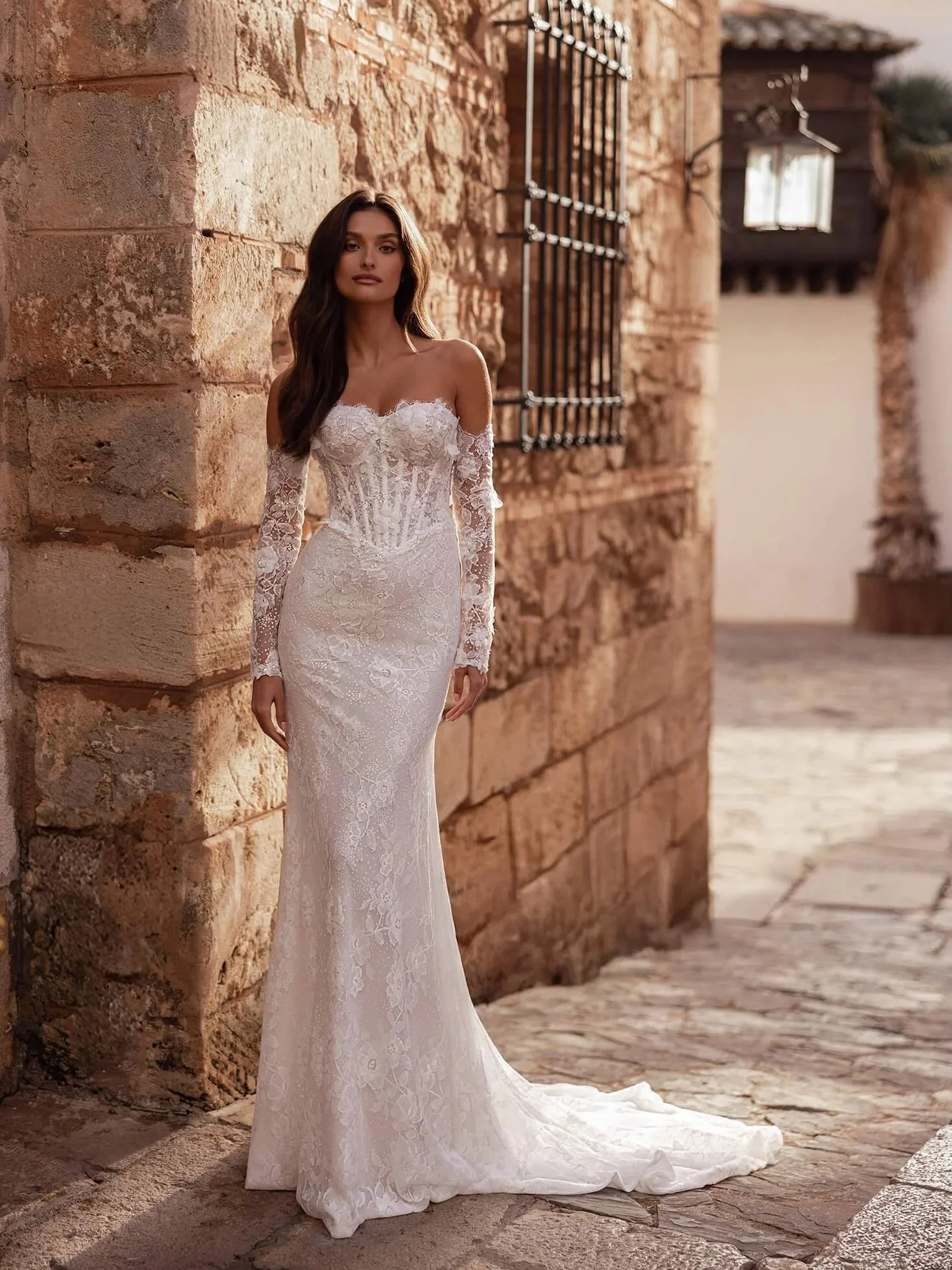 It&rsquo;s all in the details: a boned V-waist bodice, dimensional floral appliqu&eacute;s, delicate sequins, and detachable lace sleeves for the perfect ceremony-to-reception switch. ✨