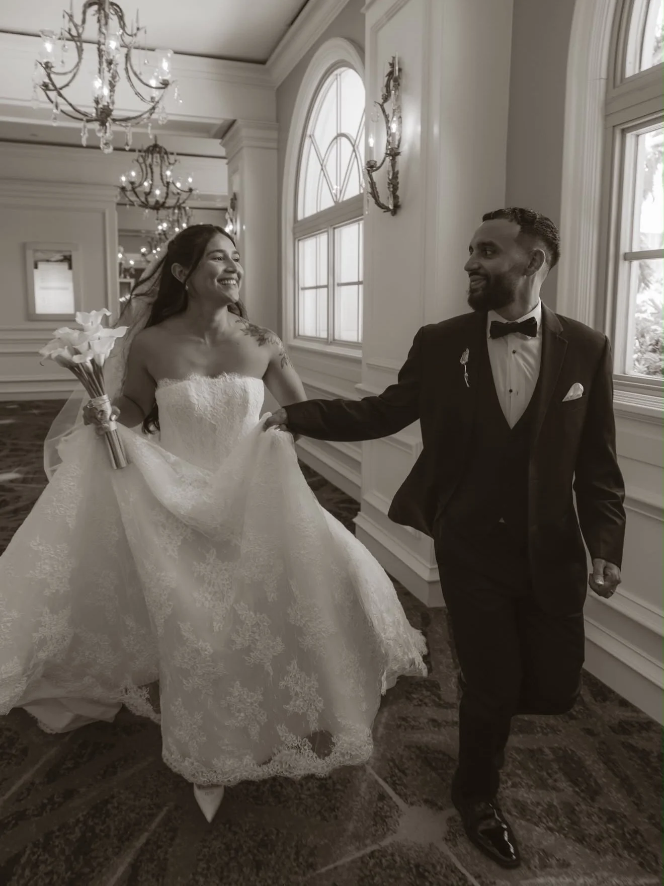 Gabrielle was timeless in allover lace, a sculpted strapless bodice, and a full A-line skirt, finished with the most breathtaking cathedral-length lace veil. 🤍
Congratulations to our beautiful bride and her husband on their stunning celebration at T