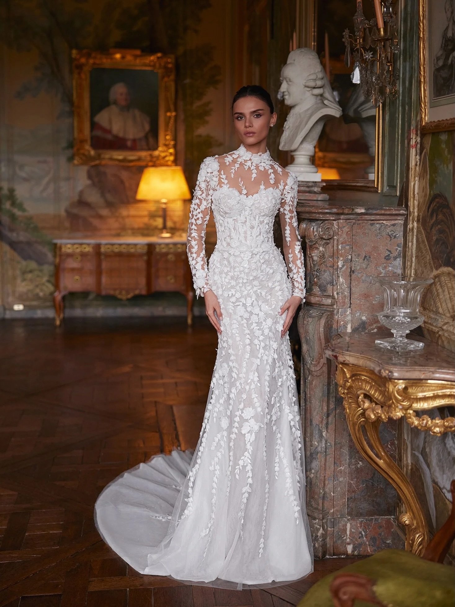 Why choose one bridal look when you can have both? Aura transforms from a fitted lace wedding dress into a romantic A-line gown with long sleeves, a detachable overskirt, and just the right amount of sparkle ✨