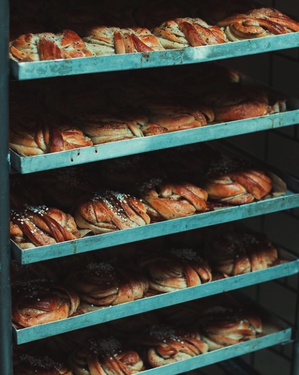 Trays of freshly bakes cinnamon buns