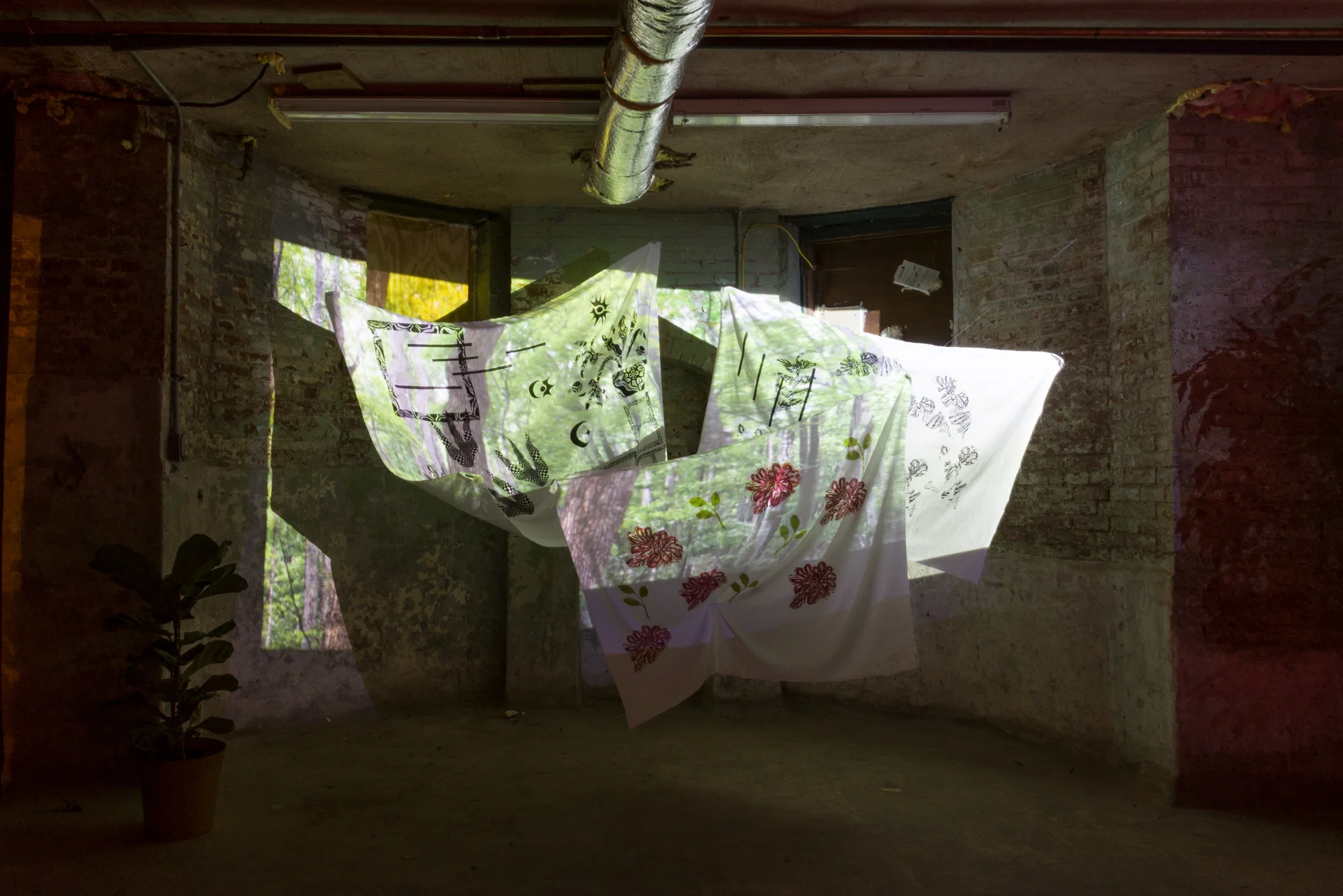 The Hidden and Unseen , 2017 Linocut on Fabric, Video projection and Sound Dimensions Vary *This a collaborative work with Linocut prints on linen, coursey of the artist Ariel Foster with projection of moving images & sound created by Erick A Benitez
