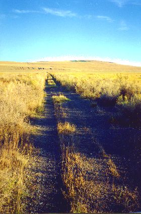 15. Made 10/18/97 about 24 miles west of Promontory Summit UT. Final Miles. Photograph by Steve Berlin. Toward the end of the day, as the shadows lengthened and we neared Golden Spike National Historic Site at Promontory Summit colors deepened and we left behind the scattered vegetation of the semi-desert and traveled through thick grease-wood and bunch grass.