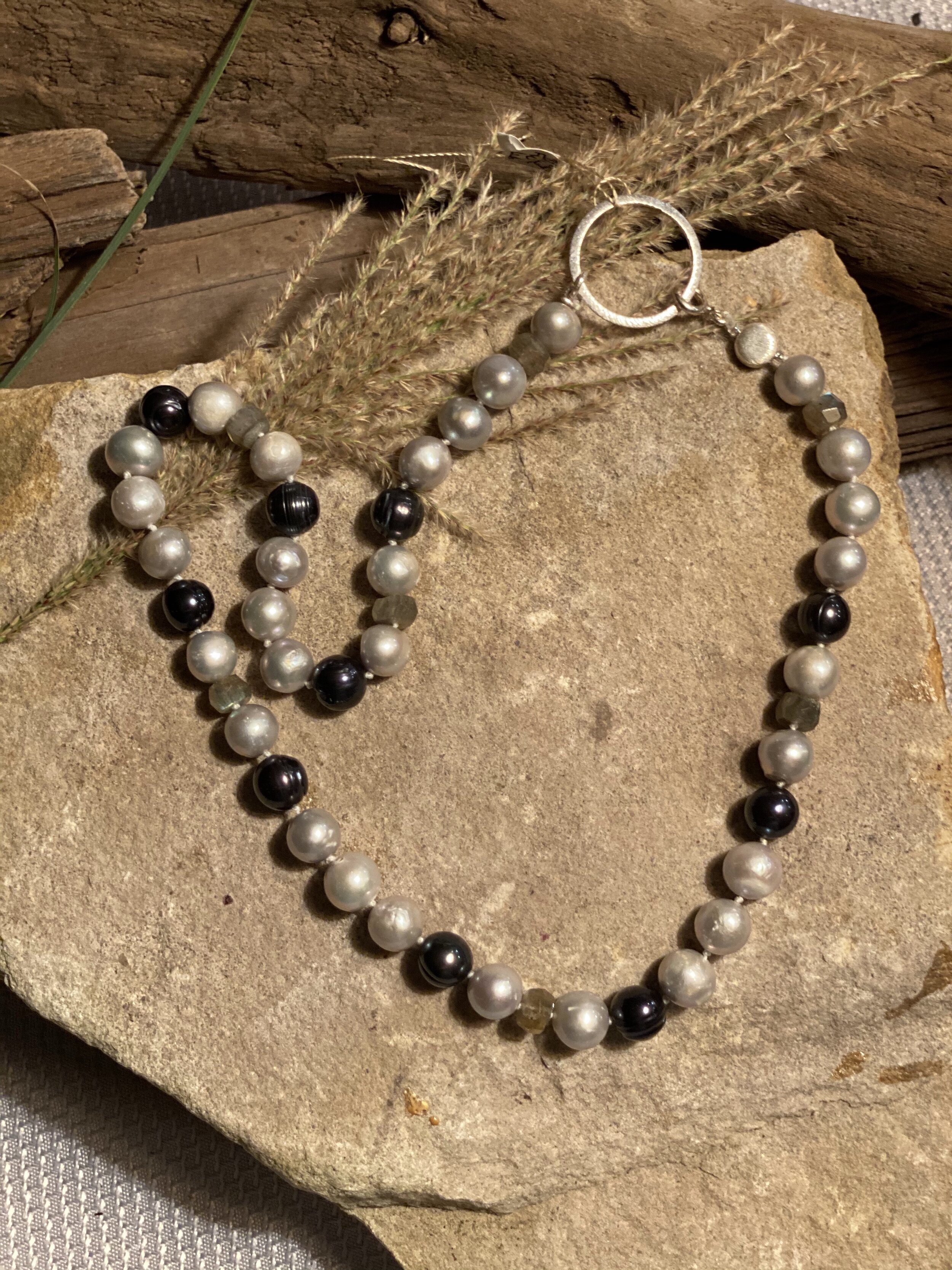 20” light gray freshwater pearls with black colored pearls and labrodite beads.