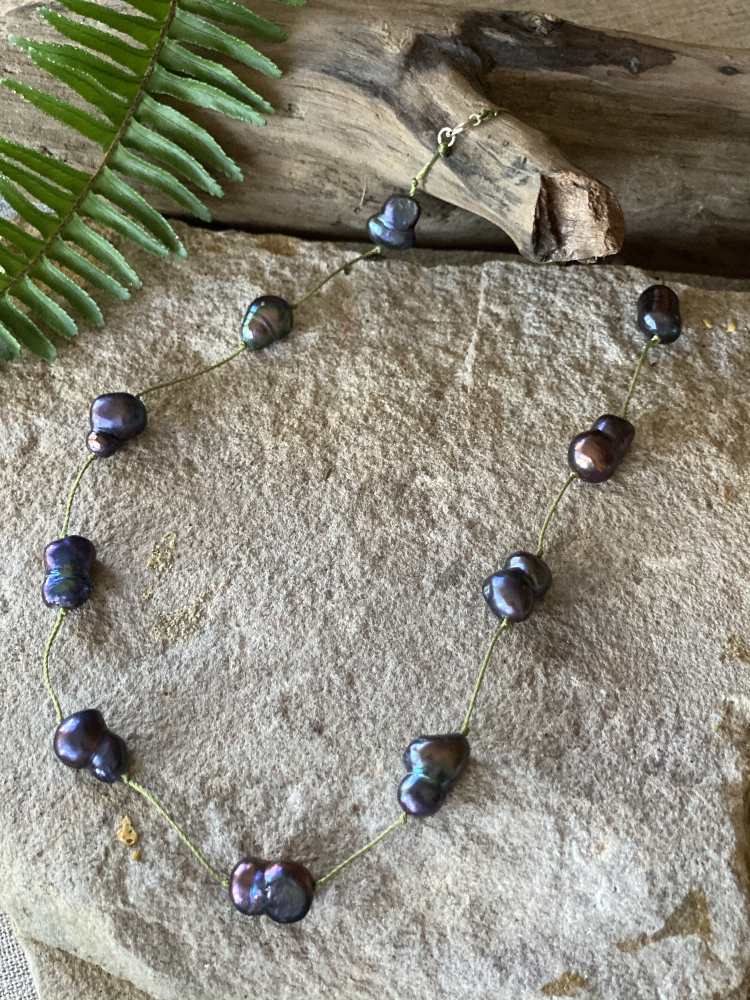 18”freshwater pearl peacock color, peanut, shape “tin cup” style pearl necklace