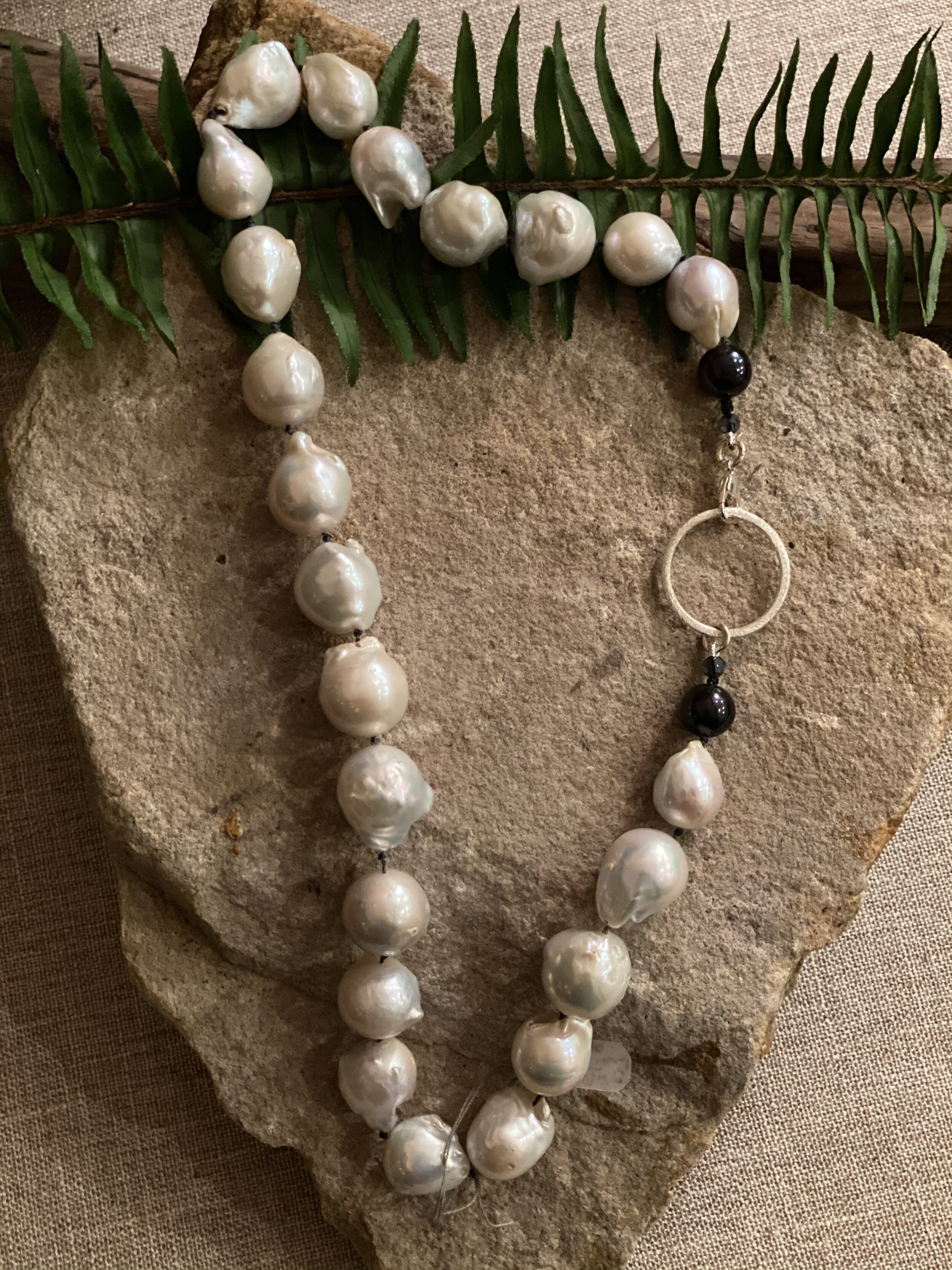 20” Natural Freshwater Baroque Pearls with black pearl accents.