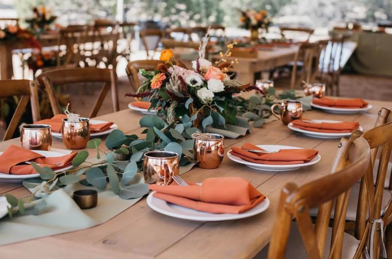 Elegant wedding tablescape showcasing wedding rentals in a desert tan and green color palette inspired by Sedona