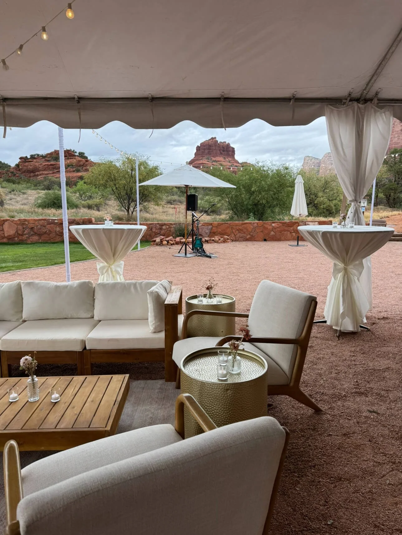 Lounge seating setup showcasing Sedona wedding rentals with white and gold furnishings arranged for guest comfort
