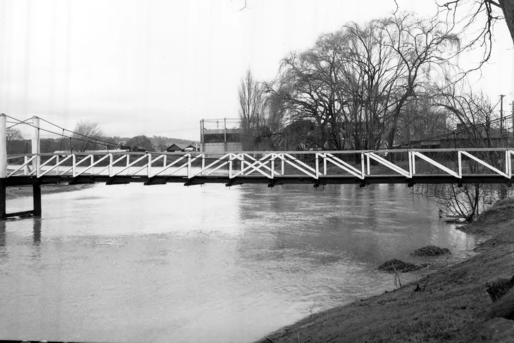 Flood waters under foot bridge south of swimming pool and north of TAFE in Dumaresq St - 1964
