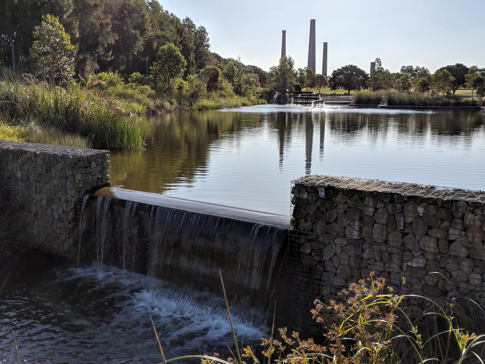 Gabions holding back water with cascading flows providing soothing sounds. Note the iconic brick kiln chimneys in the background