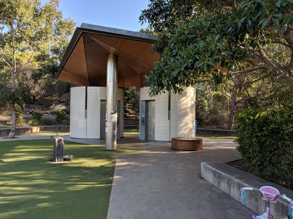 Modern toilet facilities adjacent to playground